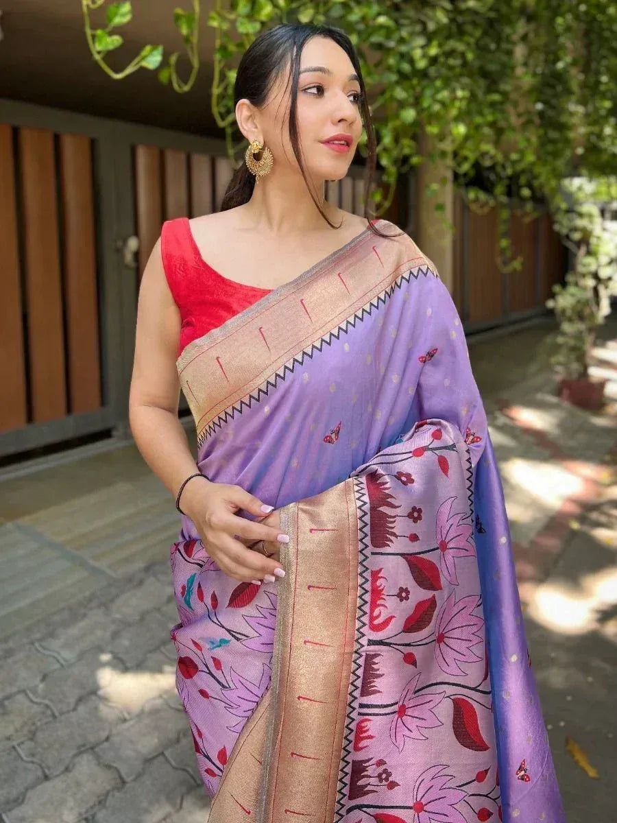 Woman in purple floral saree with red blouse, ethnic Indian wear for festive occasions