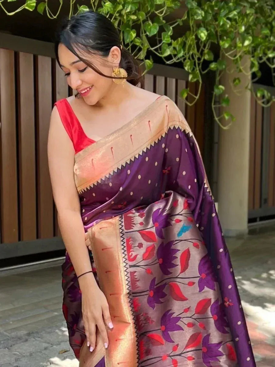 Woman in purple floral saree with gold border, red blouse, ethnic Indian wear