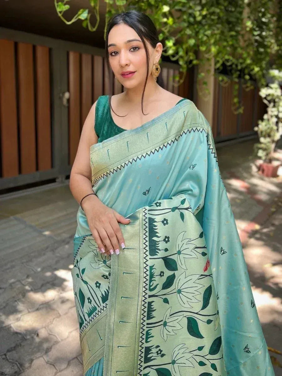 Woman in light blue floral saree with green velvet blouse, ethnic Indian wear