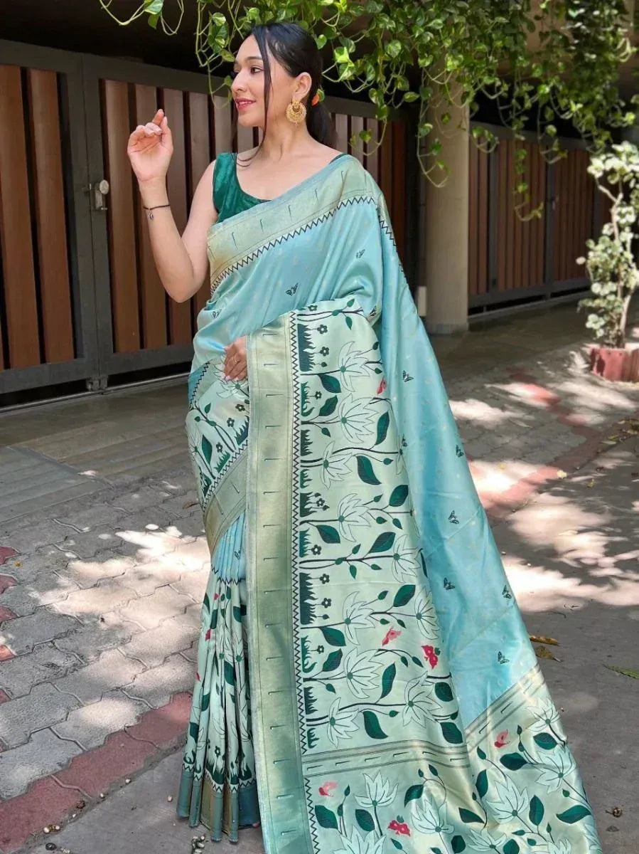 Woman in light blue floral print saree with green blouse, ethnic wear for festive occasions