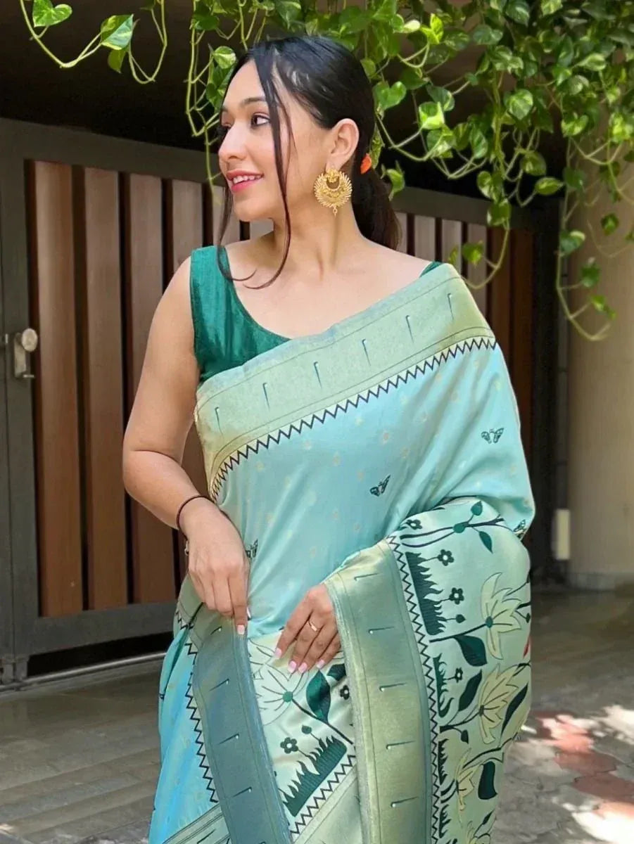 Woman in light blue floral saree with green blouse, ethnic Indian wear for festive occasions