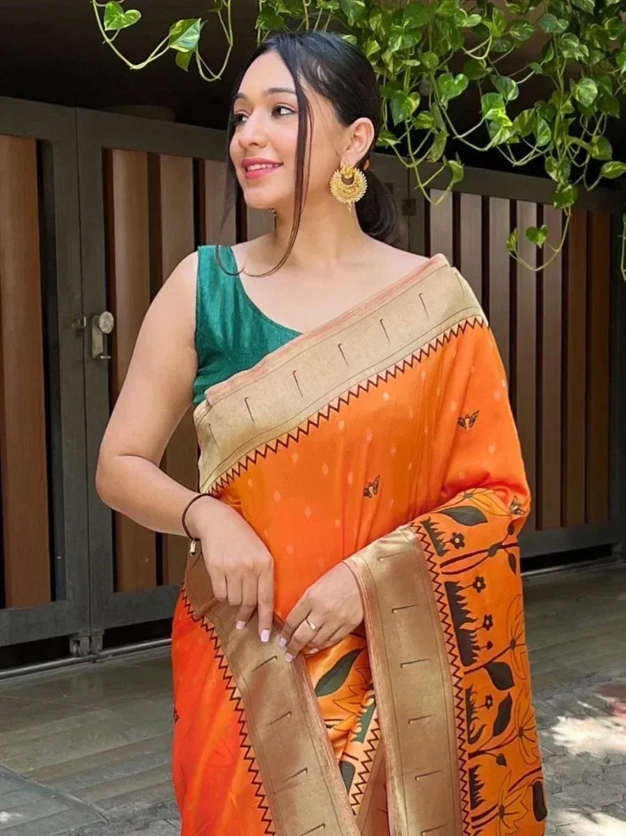 Orange printed saree with golden border, paired with green velvet blouse, perfect for ethnic occasions