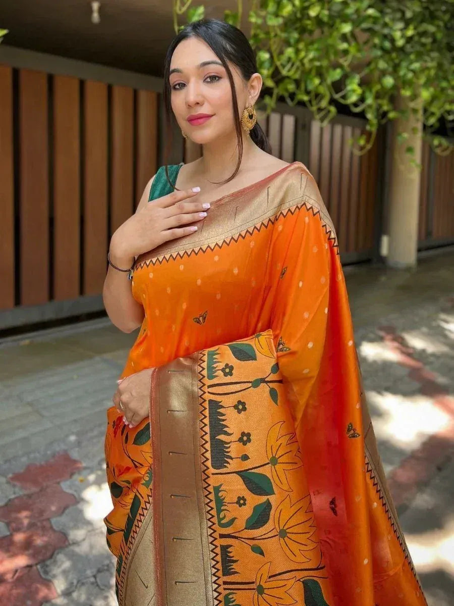Orange floral print saree with gold border, styled with green blouse for ethnic wear
