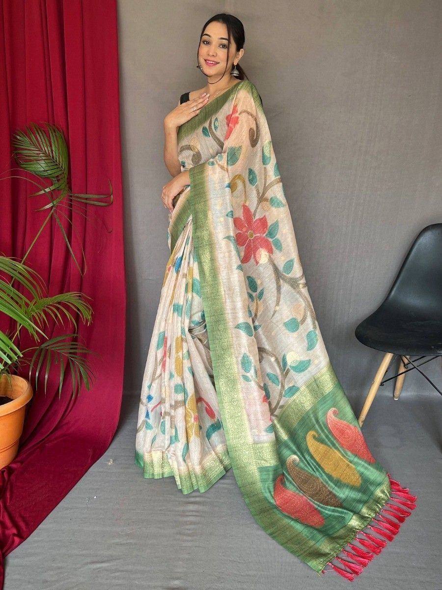 Woman wearing floral print saree with green border and red tassels, Indian ethnic wear