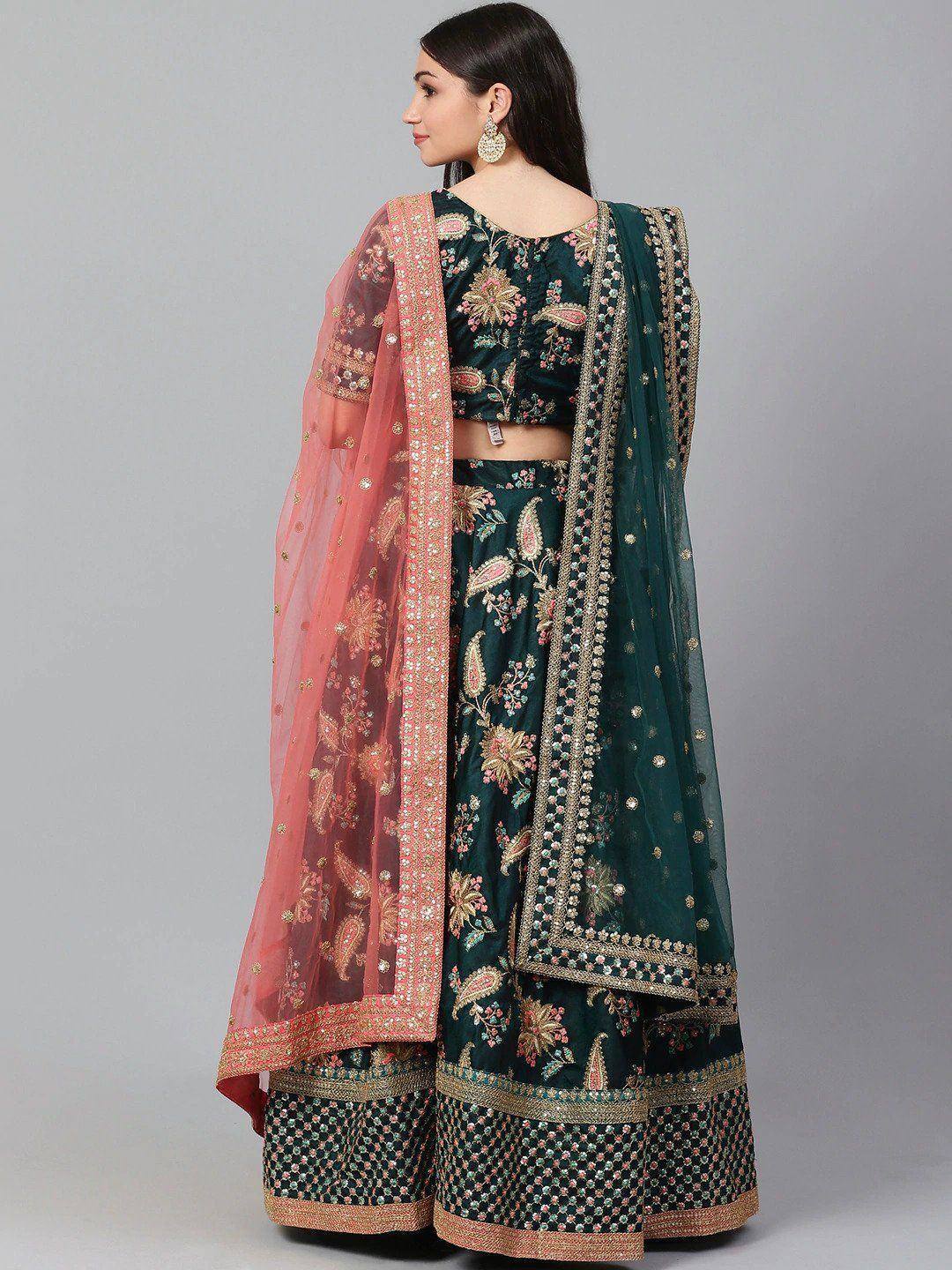 Emerald green embroidered lehenga choli with pink dupatta, perfect for Indian weddings and festive occasions.