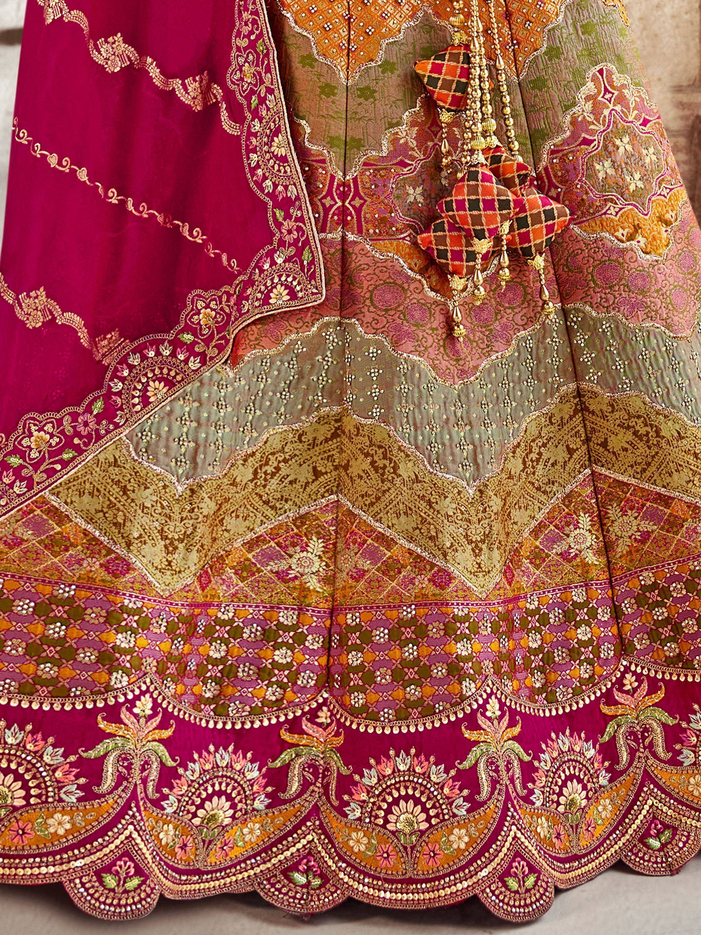 Designer lehenga choli with intricate embroidery, mirror work, and vibrant multicolor patterns for Indian ethnic wear.