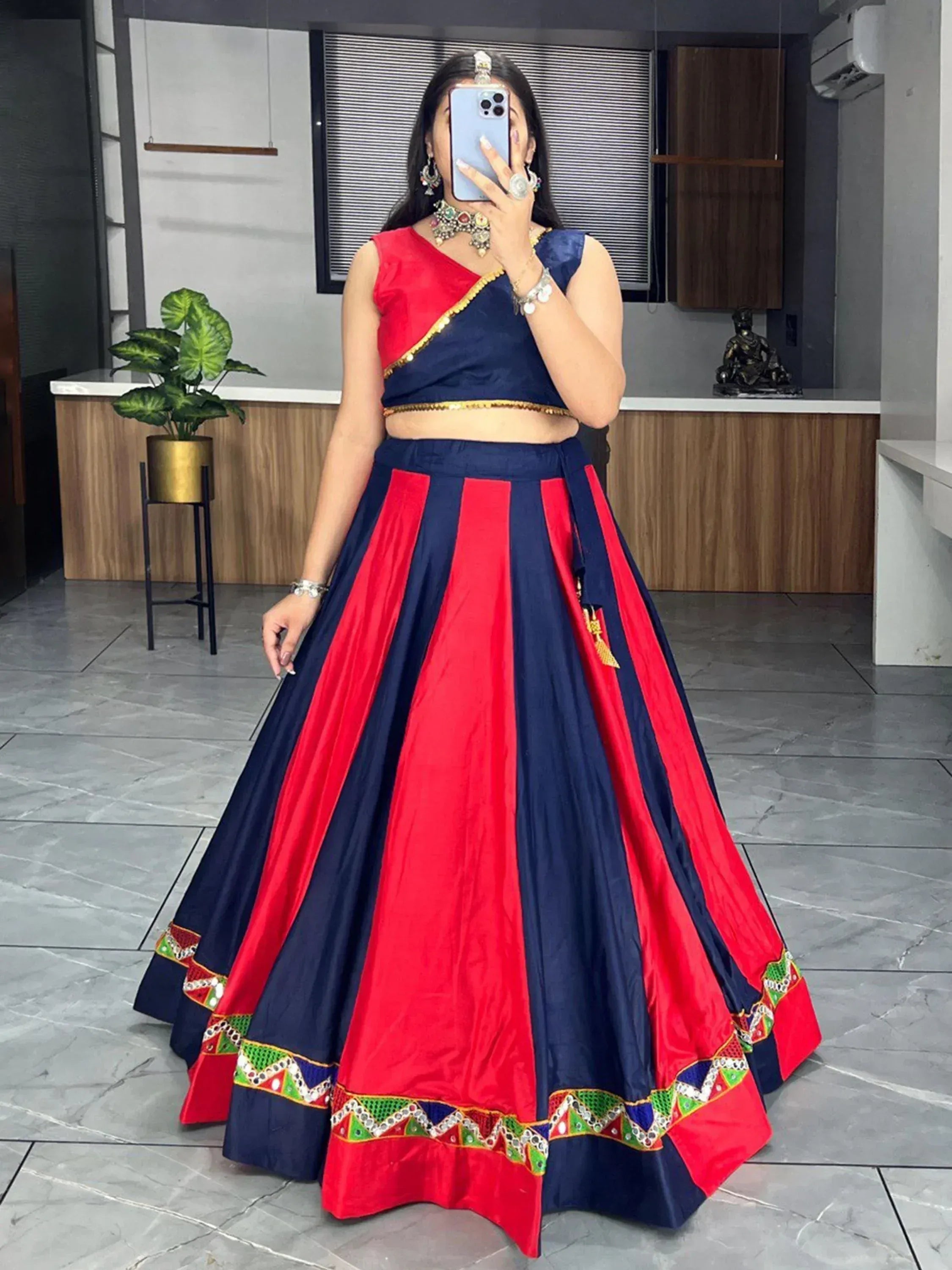 Red and navy blue designer lehenga choli with mirror work, perfect for Indian ethnic wear events