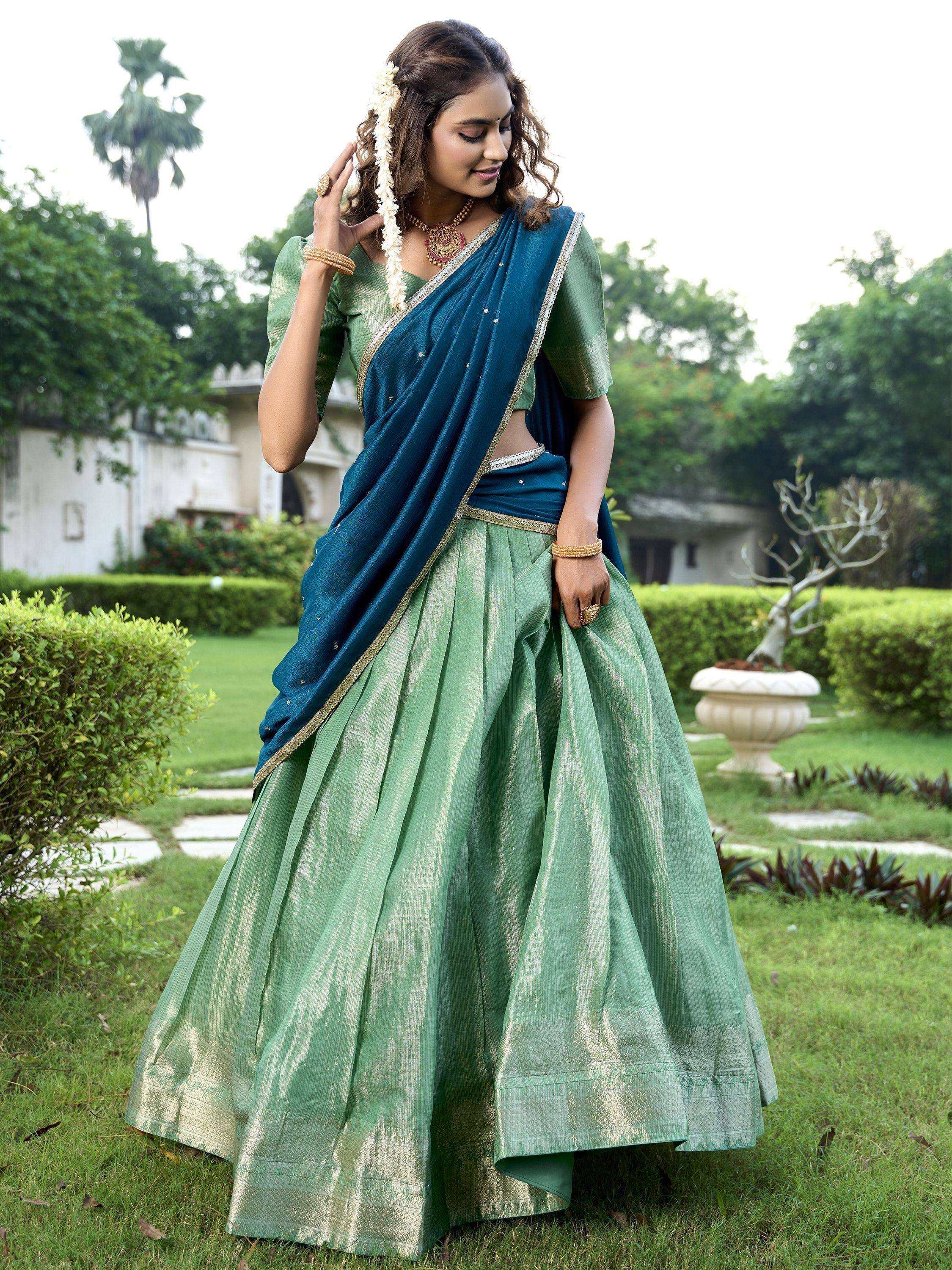 Green and blue designer lehenga choli with gold trim, perfect for Indian ethnic wear occasions
