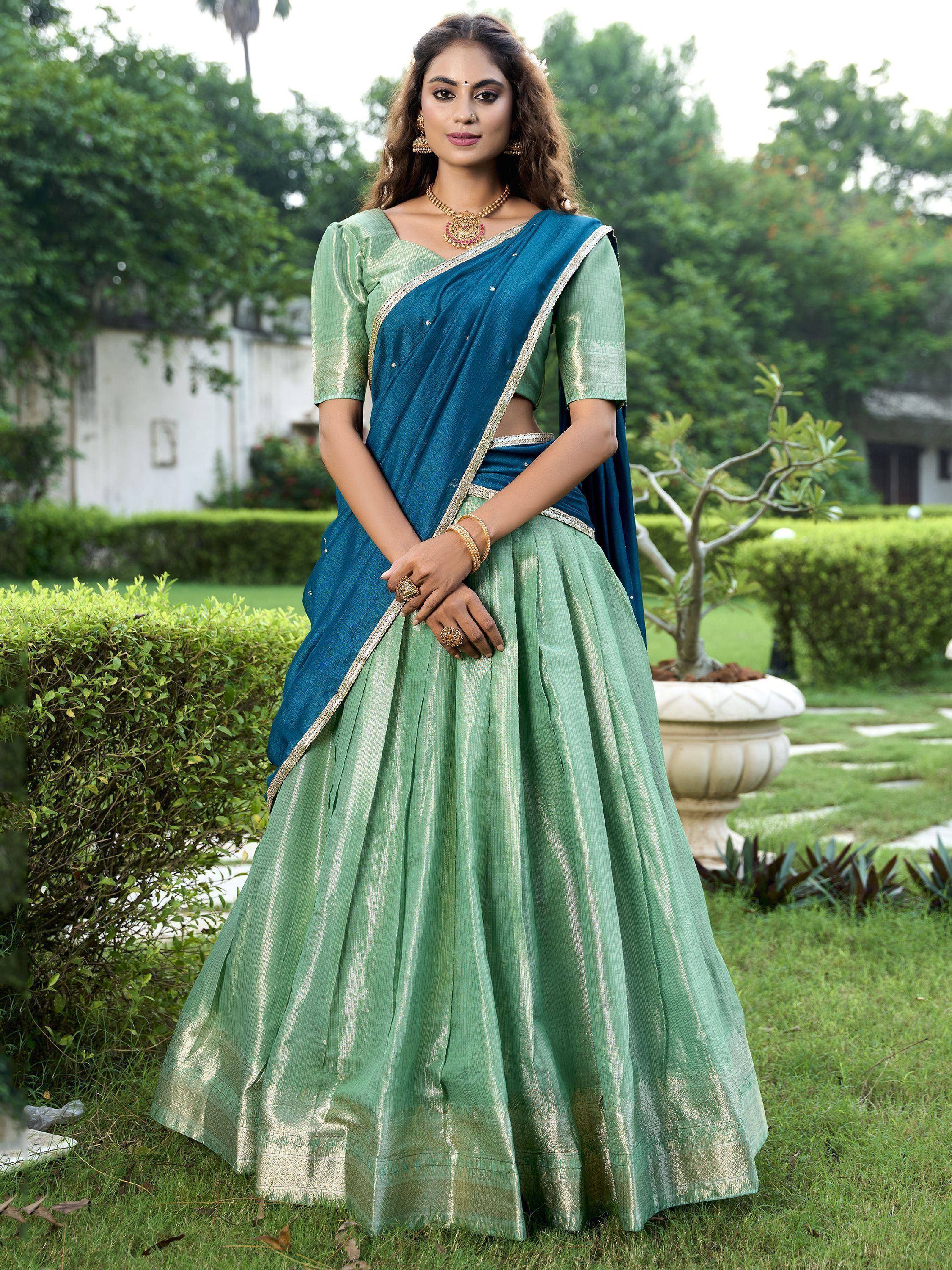Green and blue designer lehenga choli with gold trim, perfect for Indian ethnic wear occasions