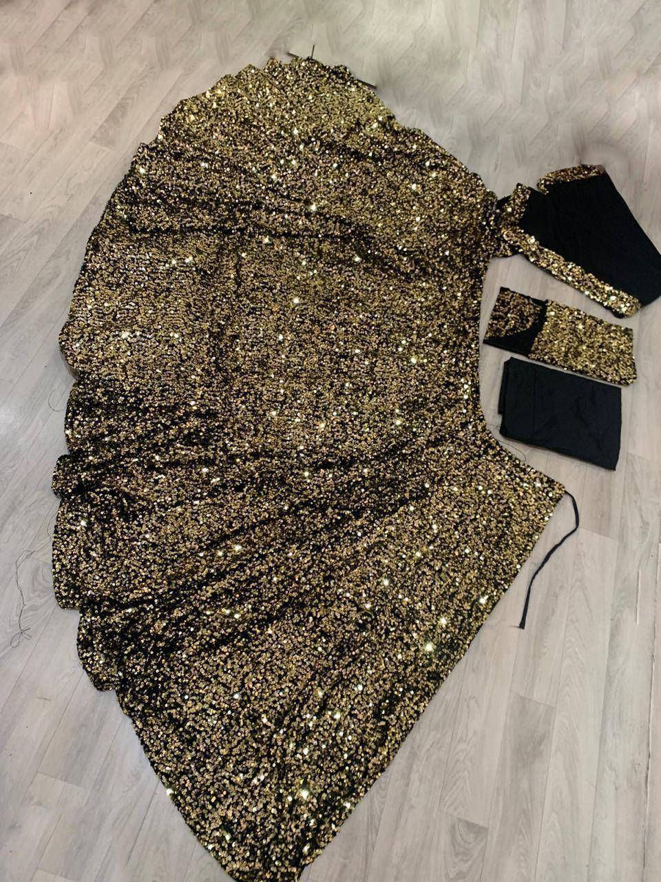 Gold sequin lehenga choli set with black blouse, perfect for Indian ethnic wear events