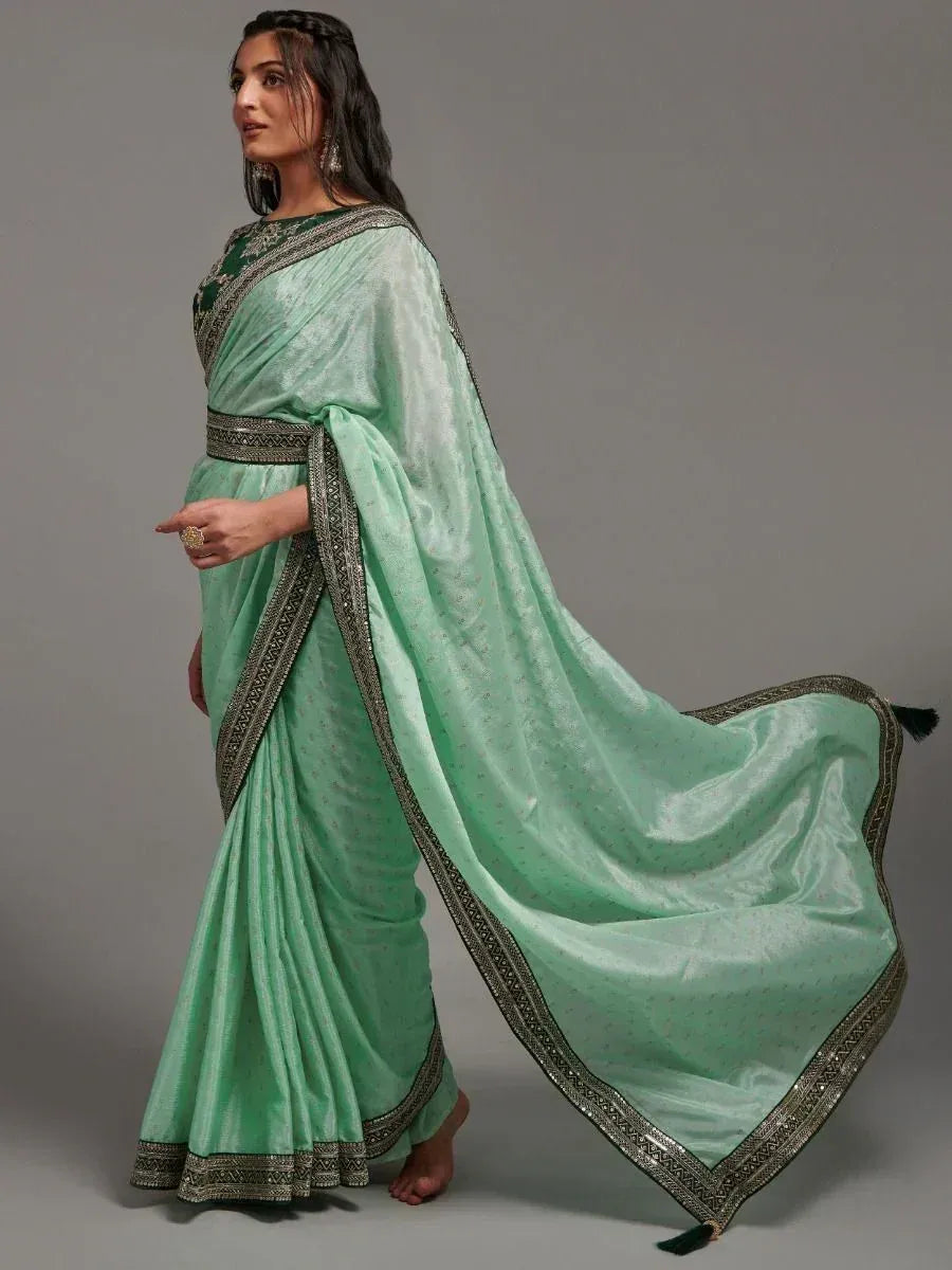 Mint green designer saree with silver border, perfect for ethnic occasions and Indian wear
