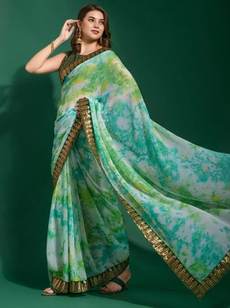 Green and white tie-dye saree with gold border, styled with ethnic blouse for Indian occasions