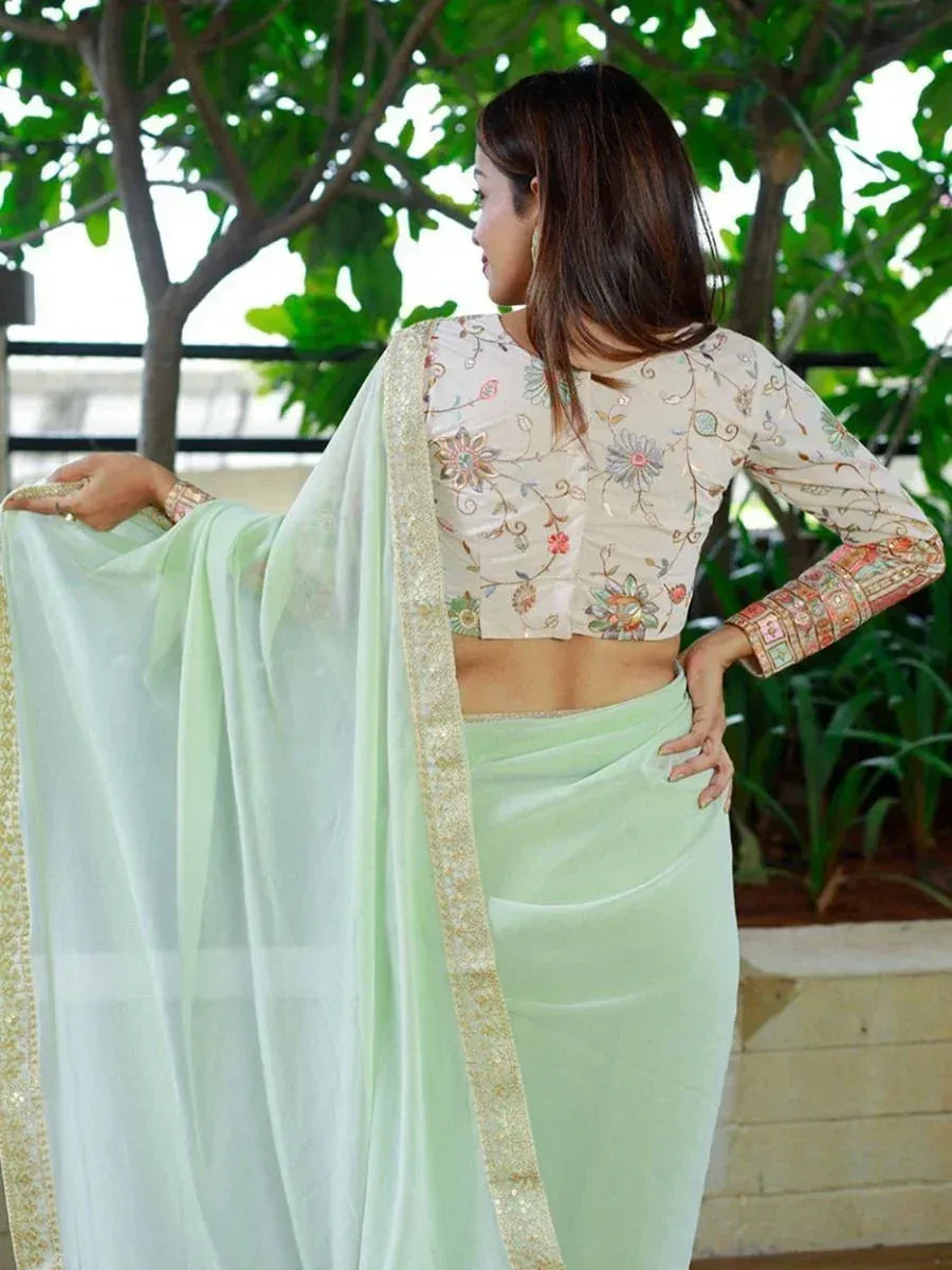Mint green ethnic saree with floral embroidered blouse, perfect for Indian occasions