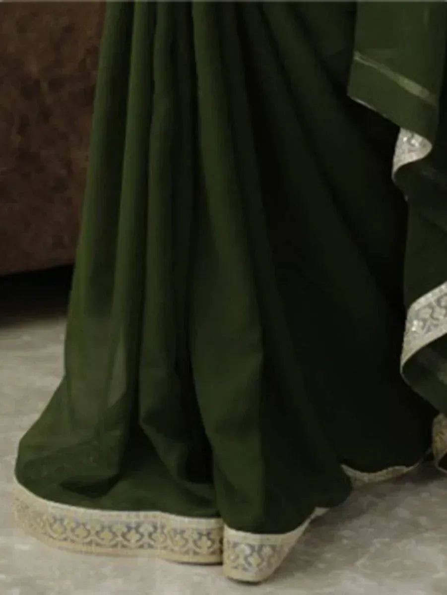 Emerald green saree with intricate gold border, elegant Indian ethnic wear