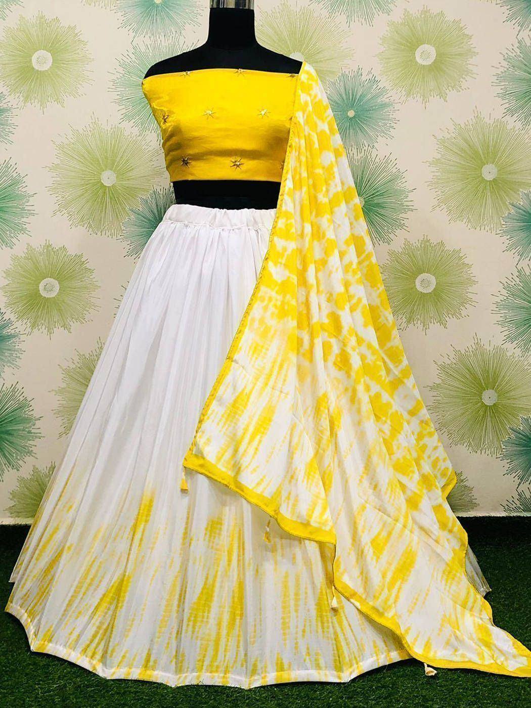 Yellow and white tie-dye lehenga choli with star embroidery, perfect for Indian ethnic wear occasions