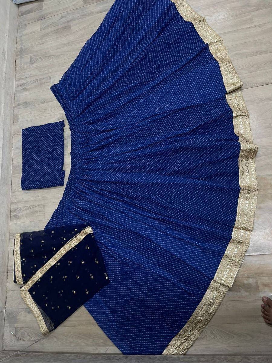 Royal blue ethnic lehenga choli with gold embroidery and sequin dupatta, perfect for weddings and festivals