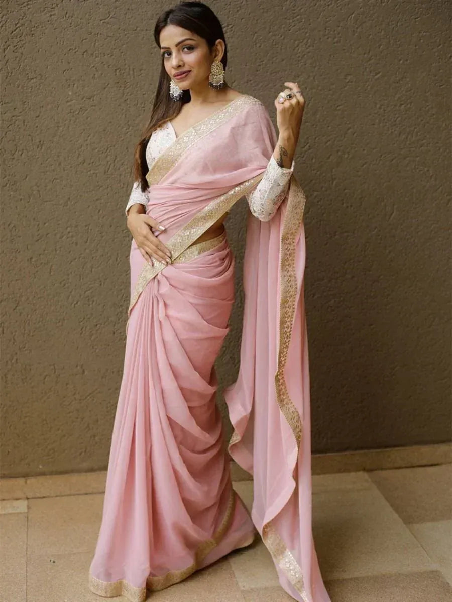 Pink designer saree with gold embroidery, perfect for ethnic occasions and Indian weddings