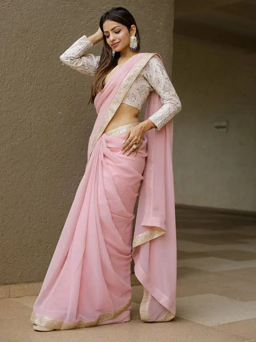 Pink designer saree with gold border and floral blouse, ethnic Indian wear for women