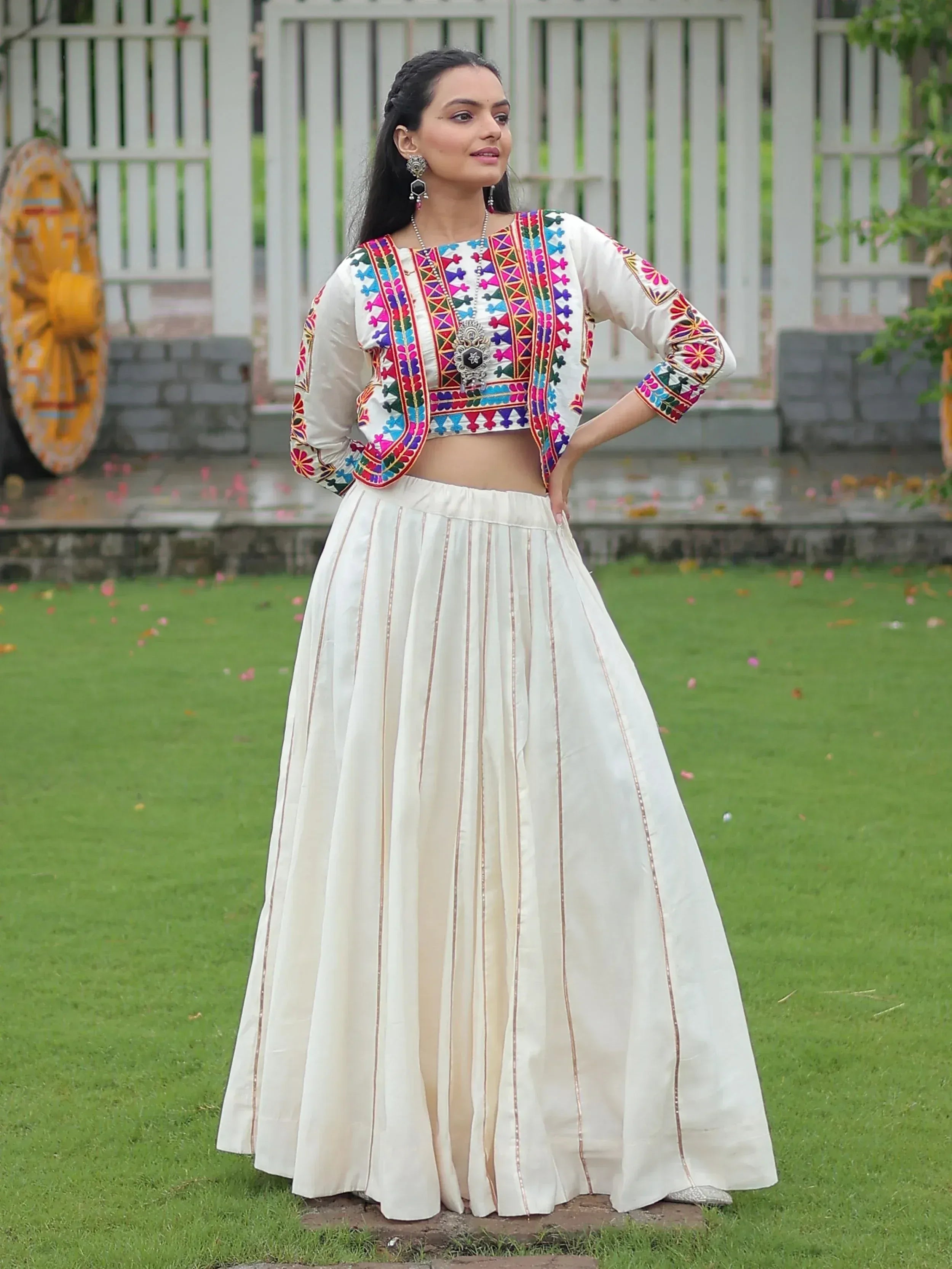 White embroidered crop top with colorful mirror work and pleated skirt, Indian ethnic wear for women