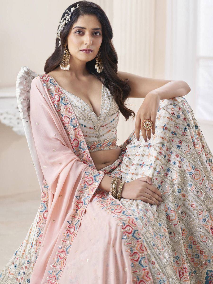 Elegant designer lehenga choli with intricate embroidery, perfect for Indian ethnic wear occasions.