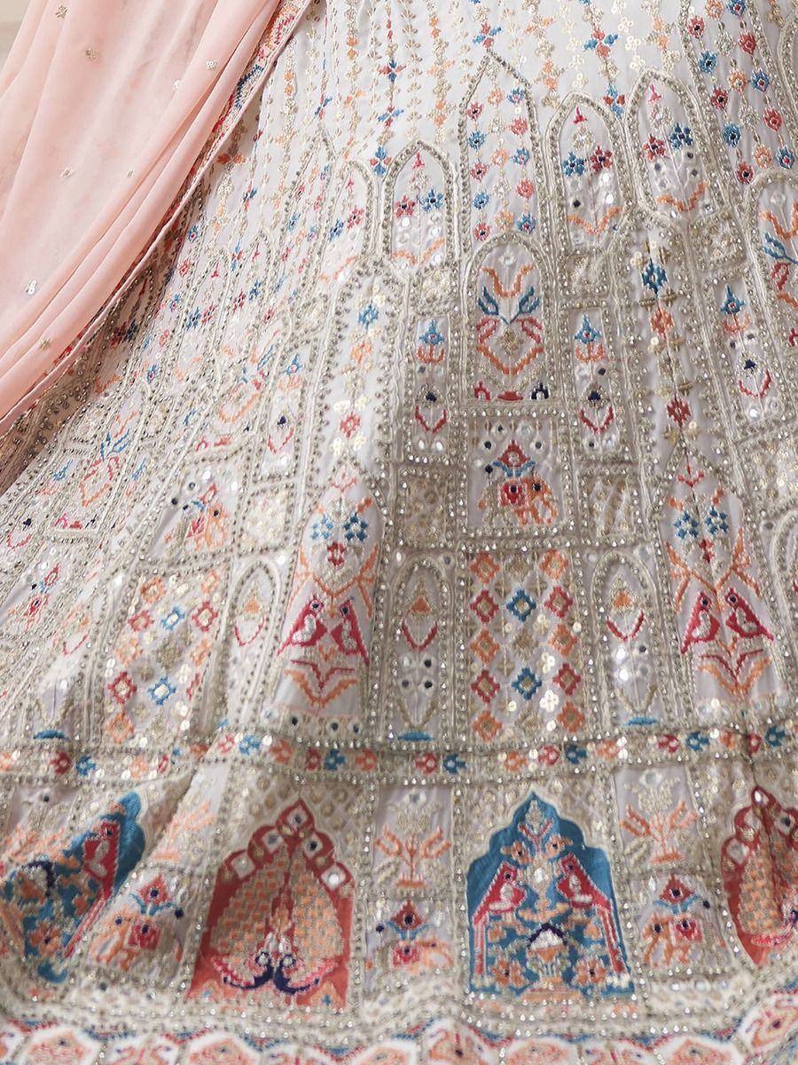 Heavily embroidered Indian lehenga with floral and bird motifs, sequins, and pastel dupatta