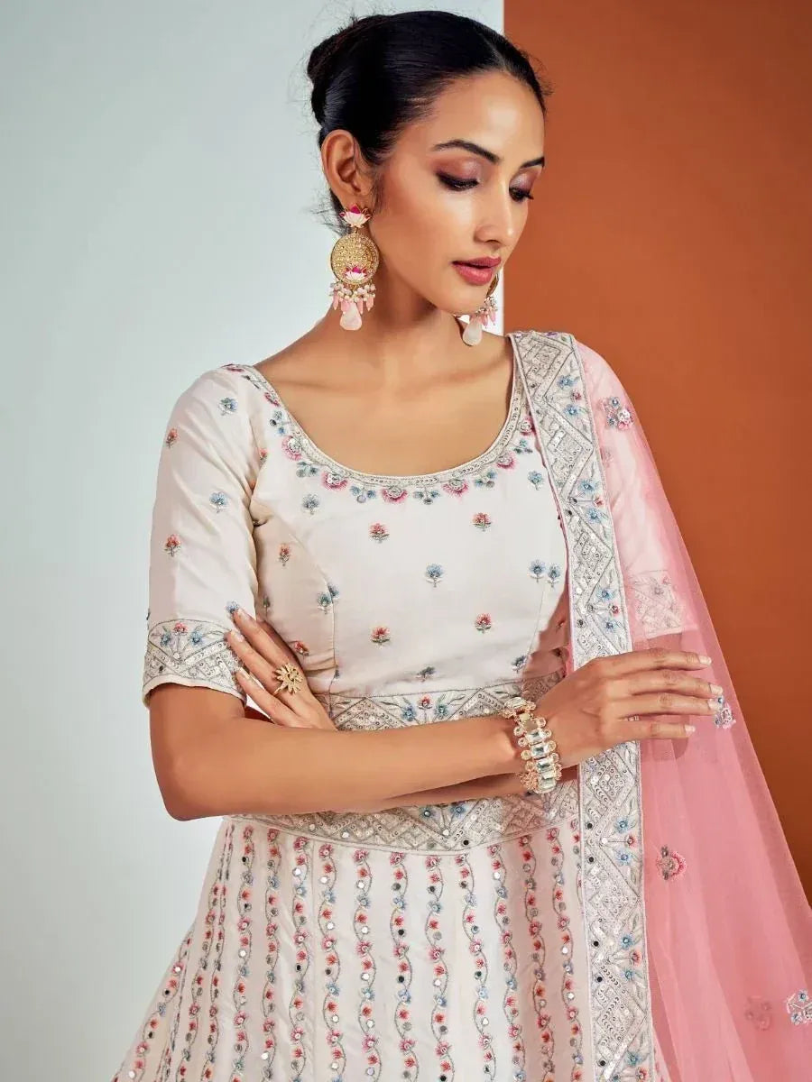 Elegant cream embroidered salwar kameez with pink dupatta, perfect for Indian ethnic occasions