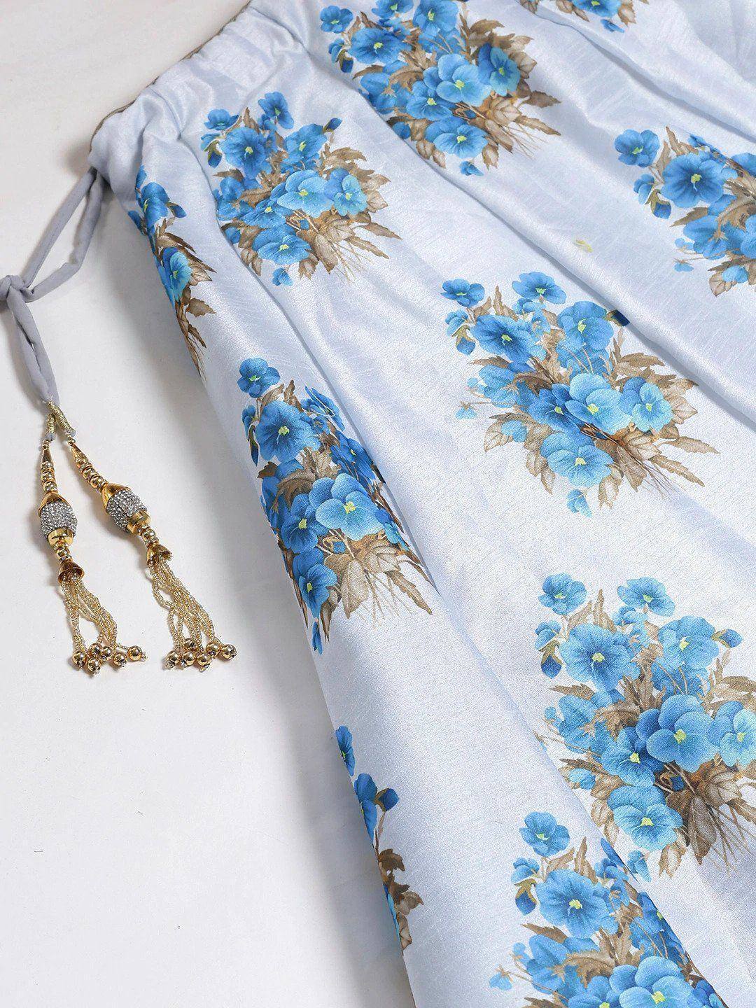 Blue floral print ethnic gown with gold tassels, perfect for Indian occasions