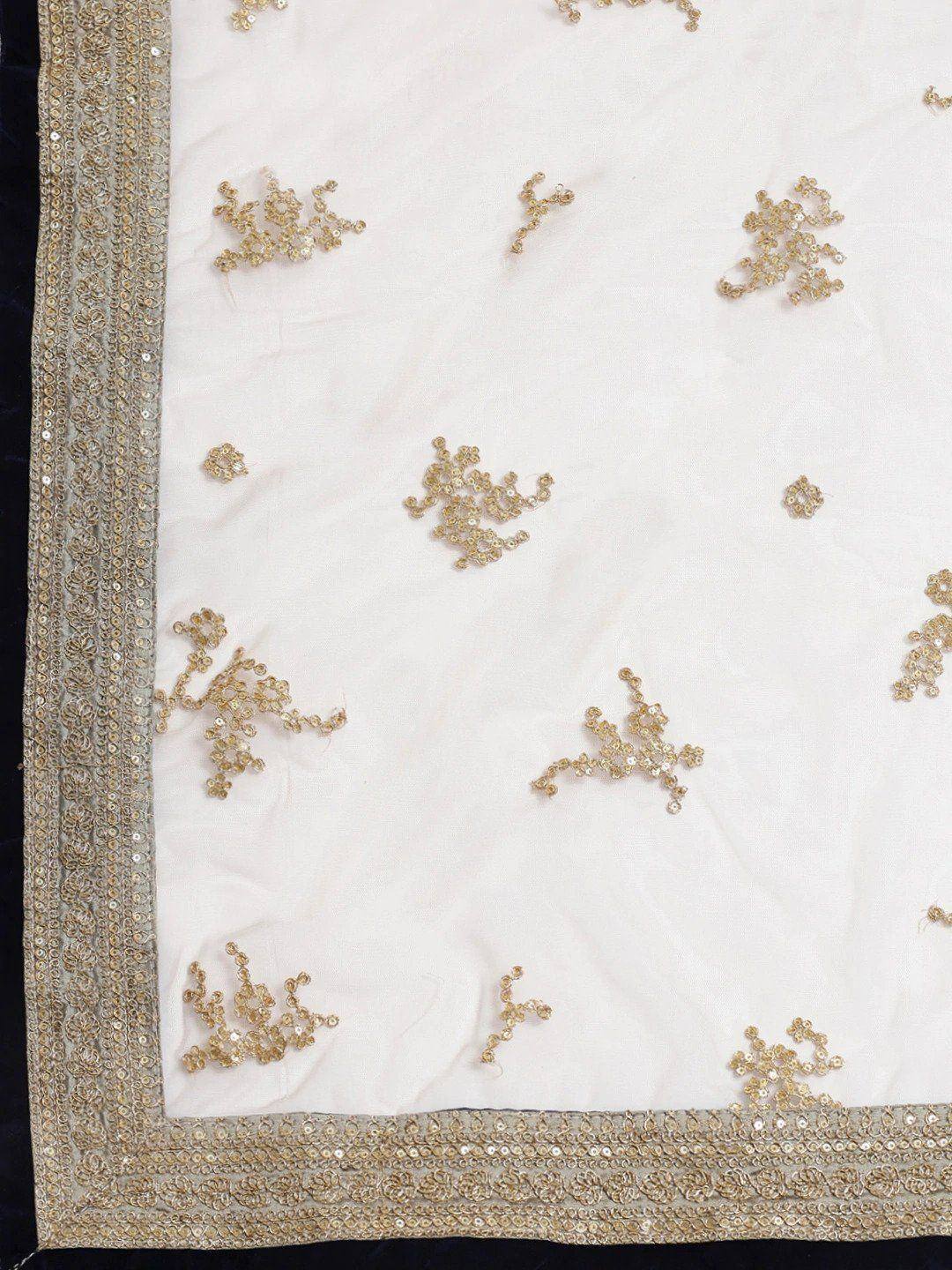 White ethnic fabric with gold sequin embroidery and border, ideal for designer lehenga or saree