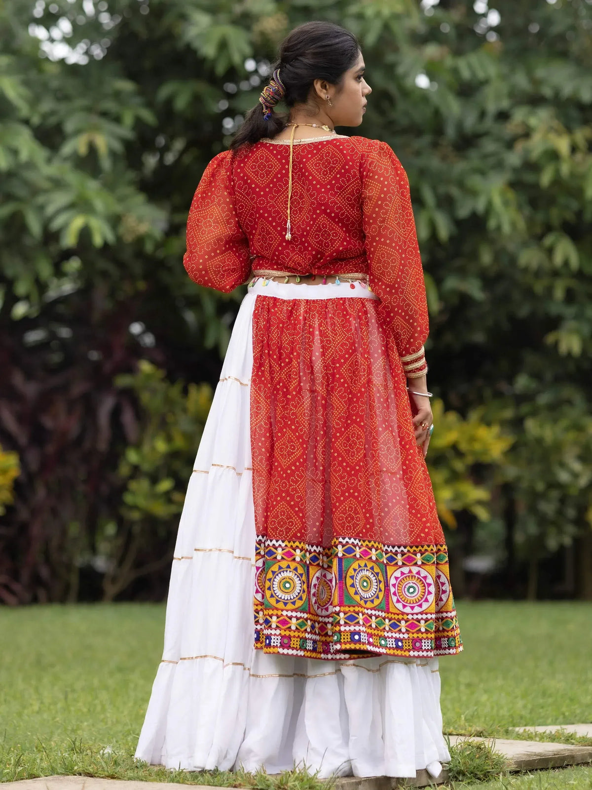 Red and white ethnic Anarkali suit with mirror work, perfect for Indian festivals and weddings