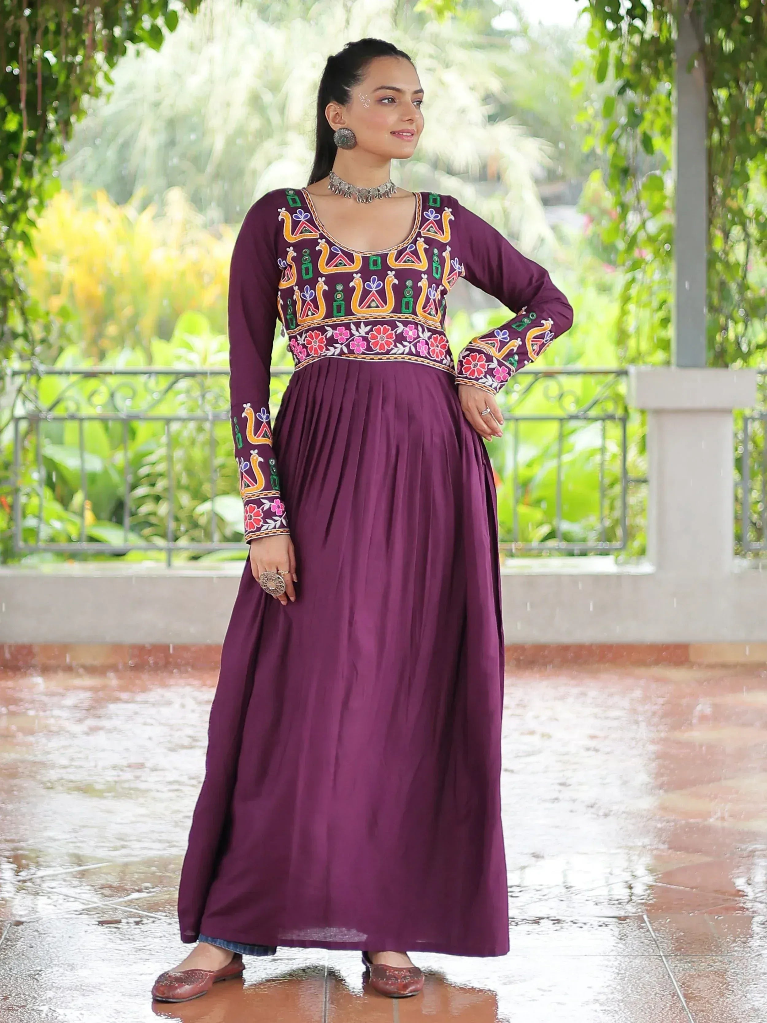 Purple ethnic gown with colorful peacock embroidery, perfect for Indian festive occasions