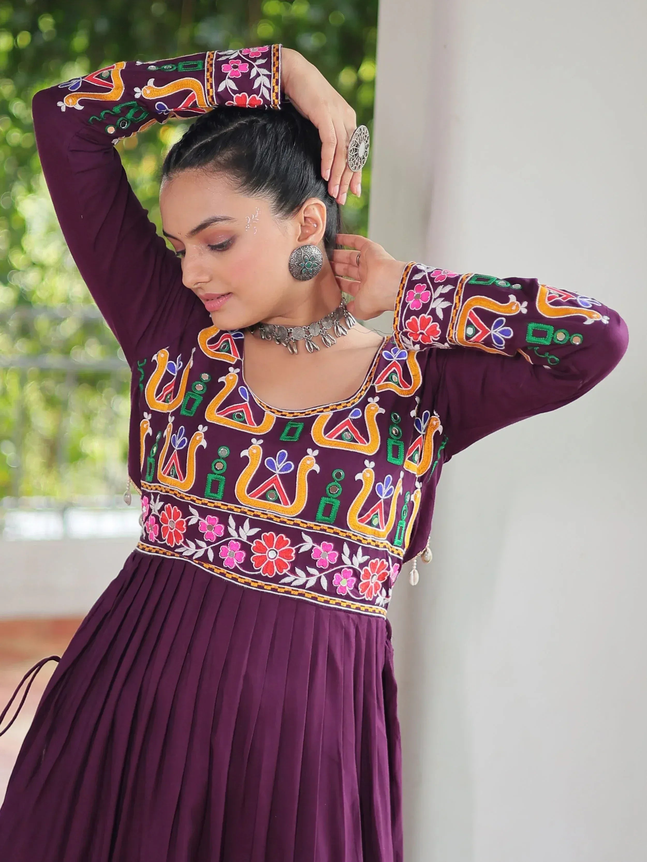 Purple embroidered ethnic gown with floral and peacock motifs, perfect for Indian festive wear