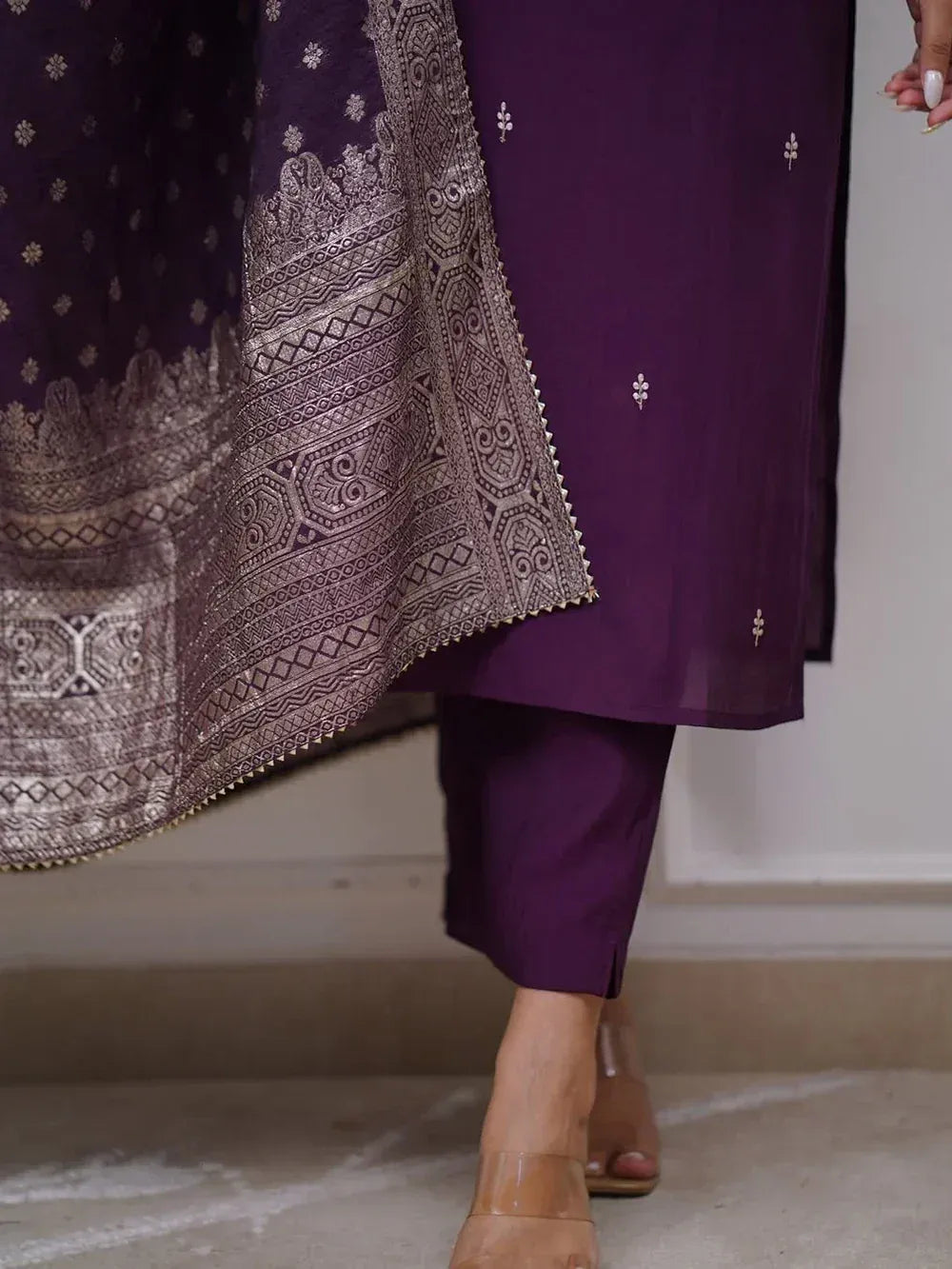 Purple ethnic salwar kameez with intricate silver embroidery and matching dupatta, perfect for Indian occasions.