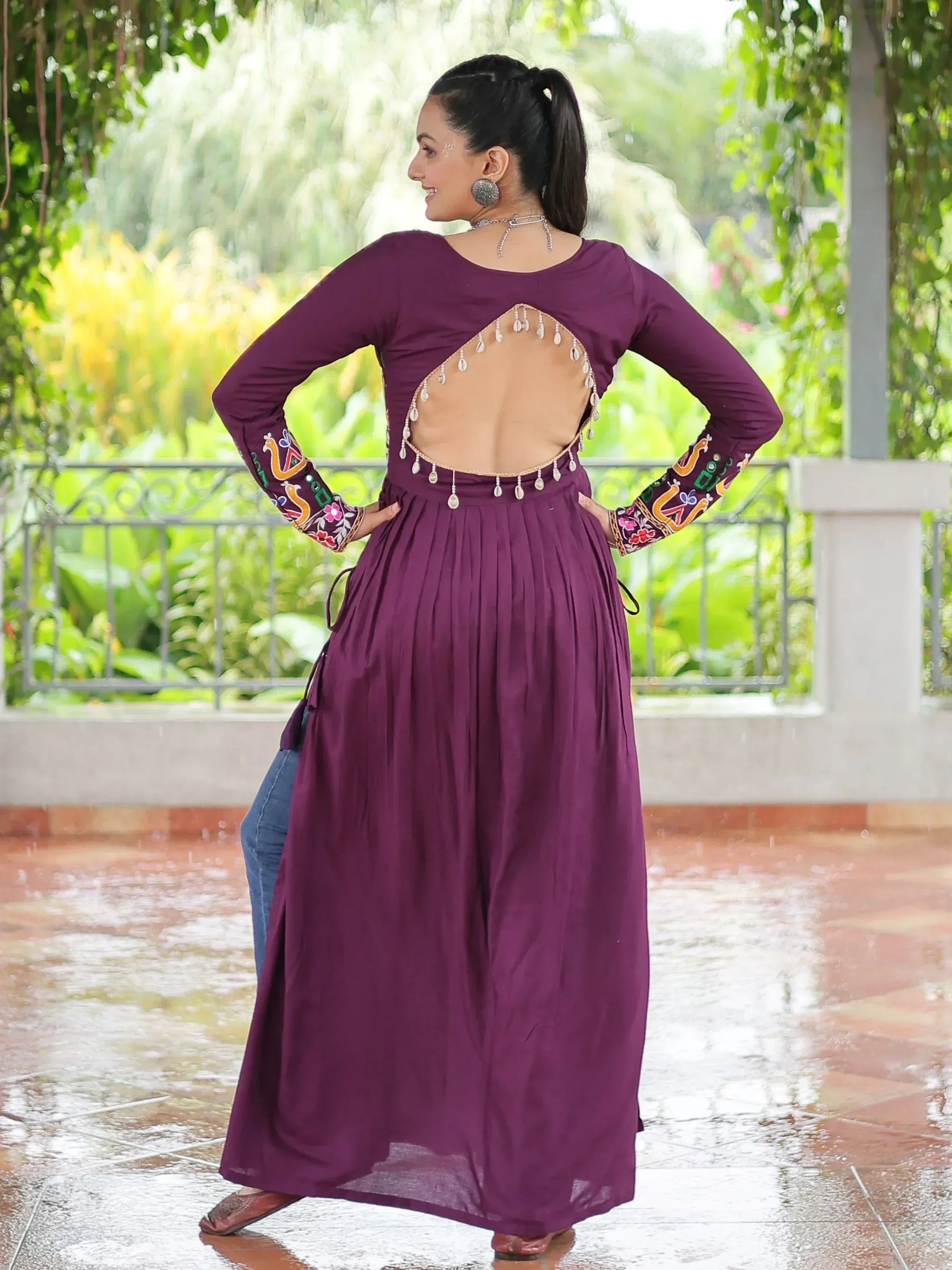 Purple ethnic gown with back cutout and embroidery, perfect for Indian festive wear