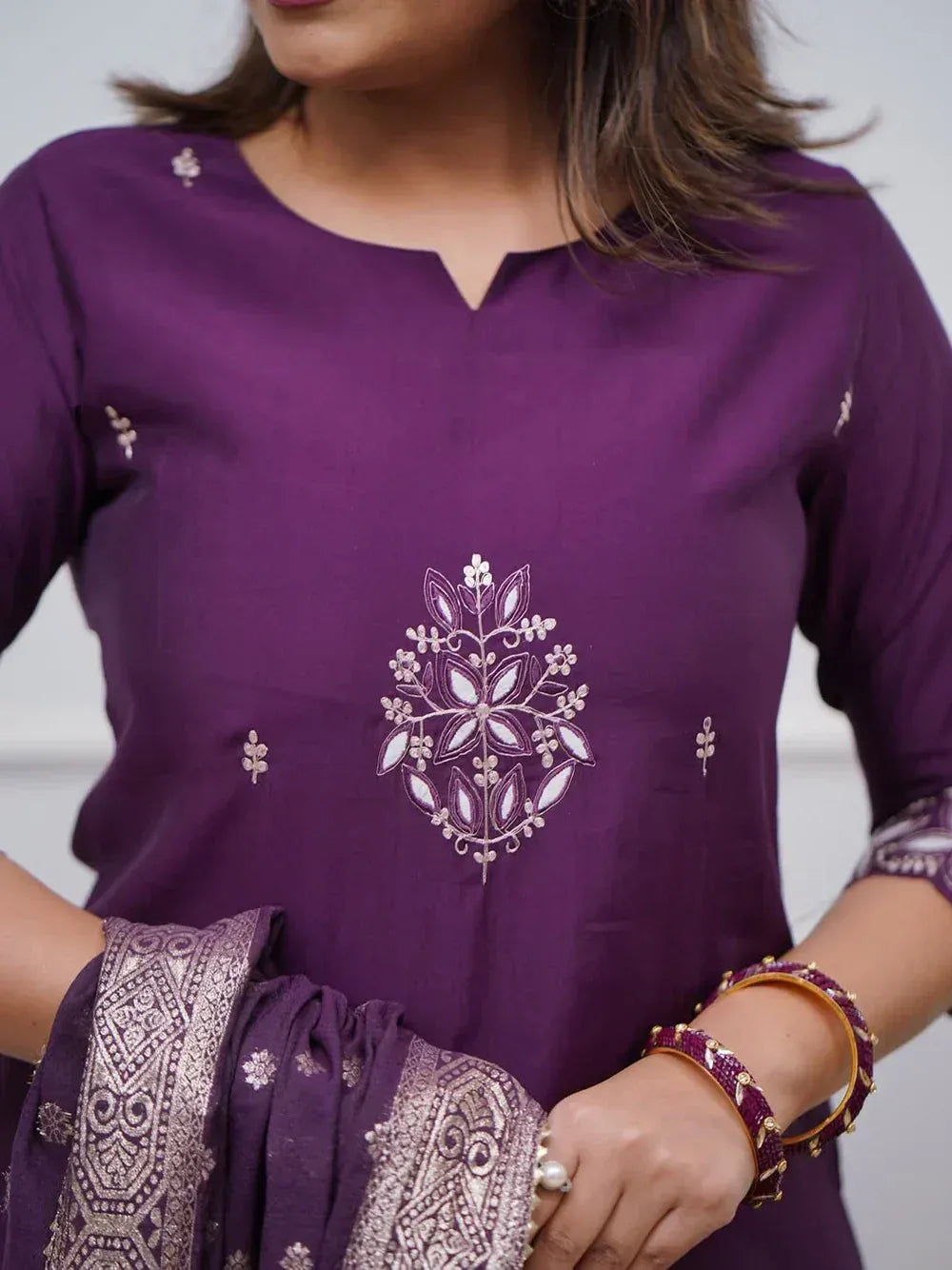 Purple embroidered kurta with floral design, paired with matching dupatta for ethnic wear