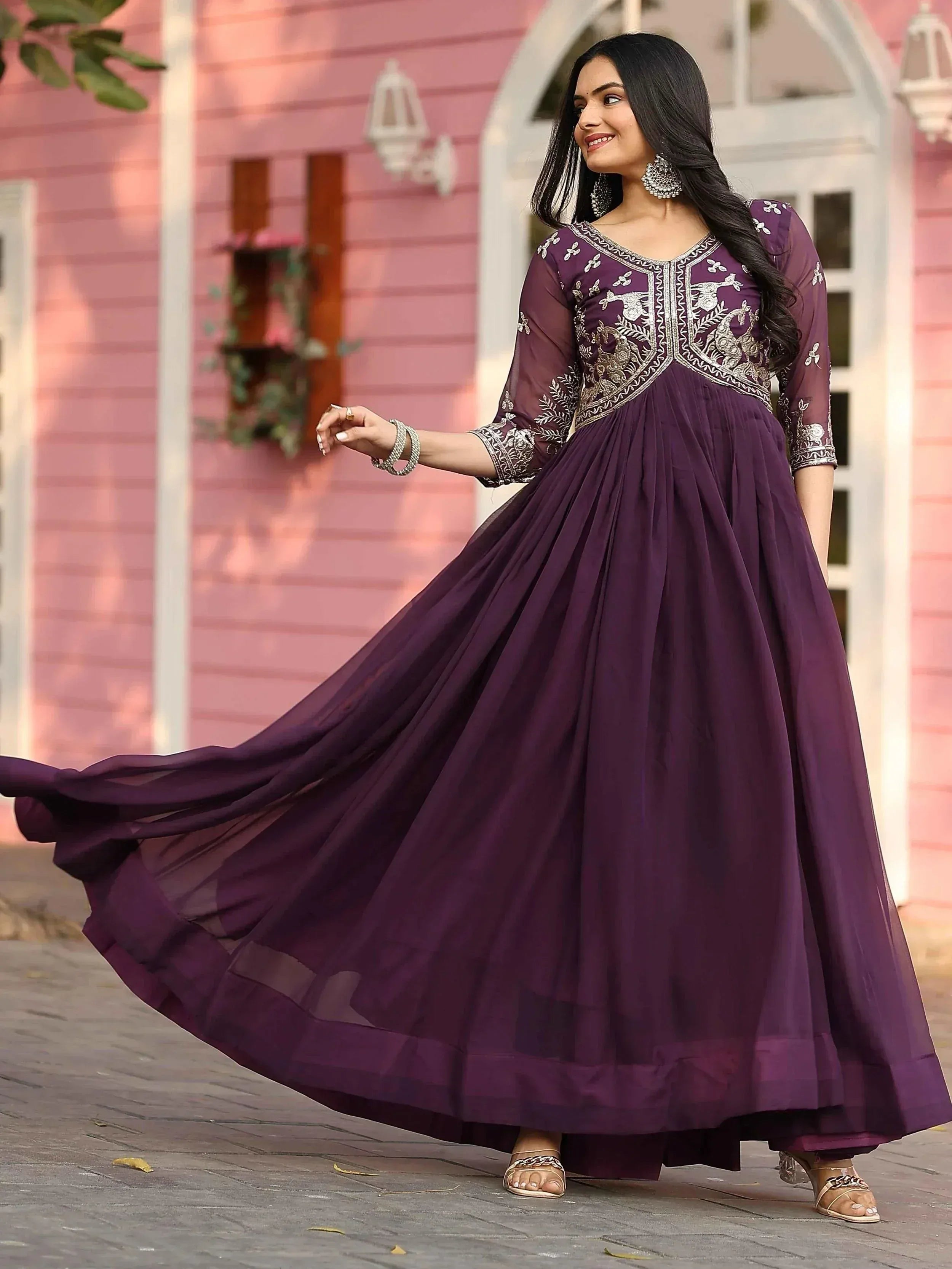Elegant purple ethnic gown with intricate embroidery, perfect for Indian celebrations