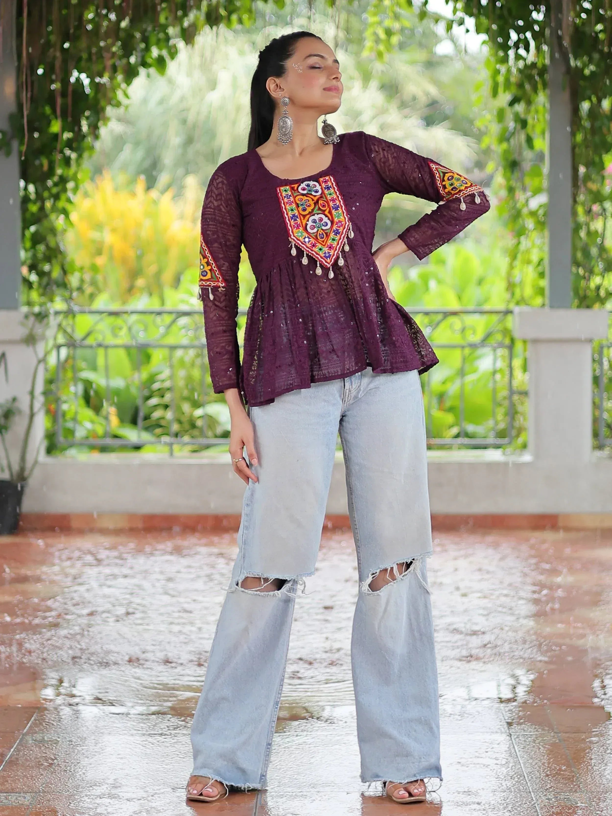 Purple embroidered ethnic top with lace sleeves paired with ripped wide-leg jeans, perfect for fusion fashion.