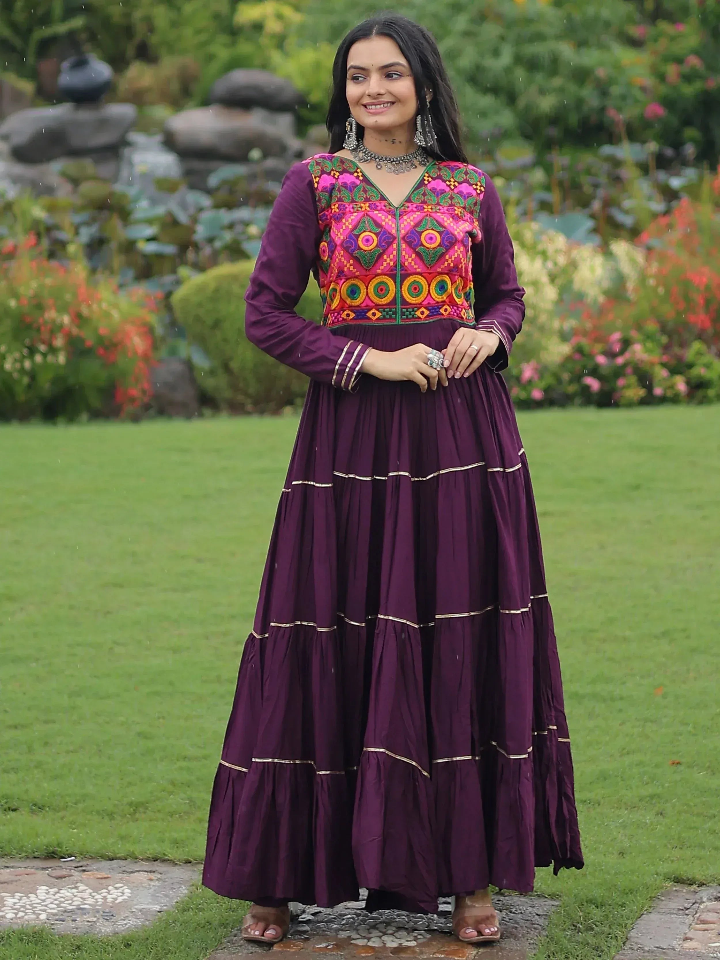 Purple ethnic gown with vibrant embroidered yoke, perfect for Indian festive wear and occasions.