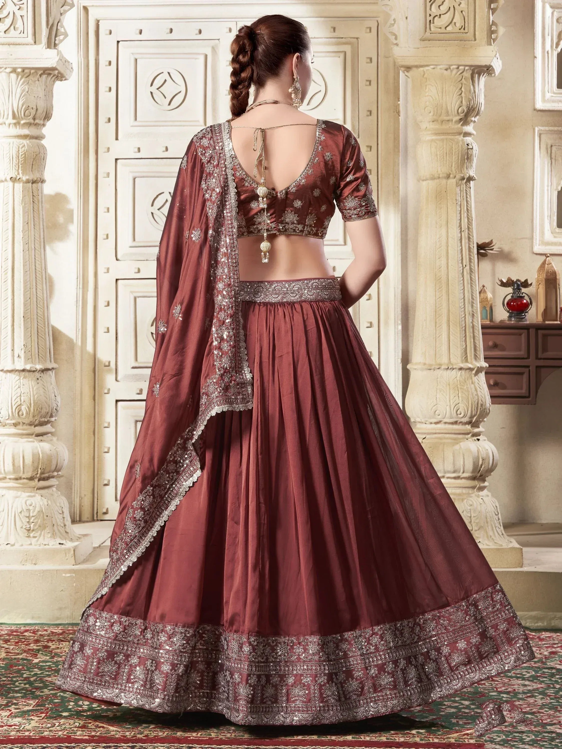 Maroon designer lehenga choli with silver embroidery, back view, ethnic wear for weddings