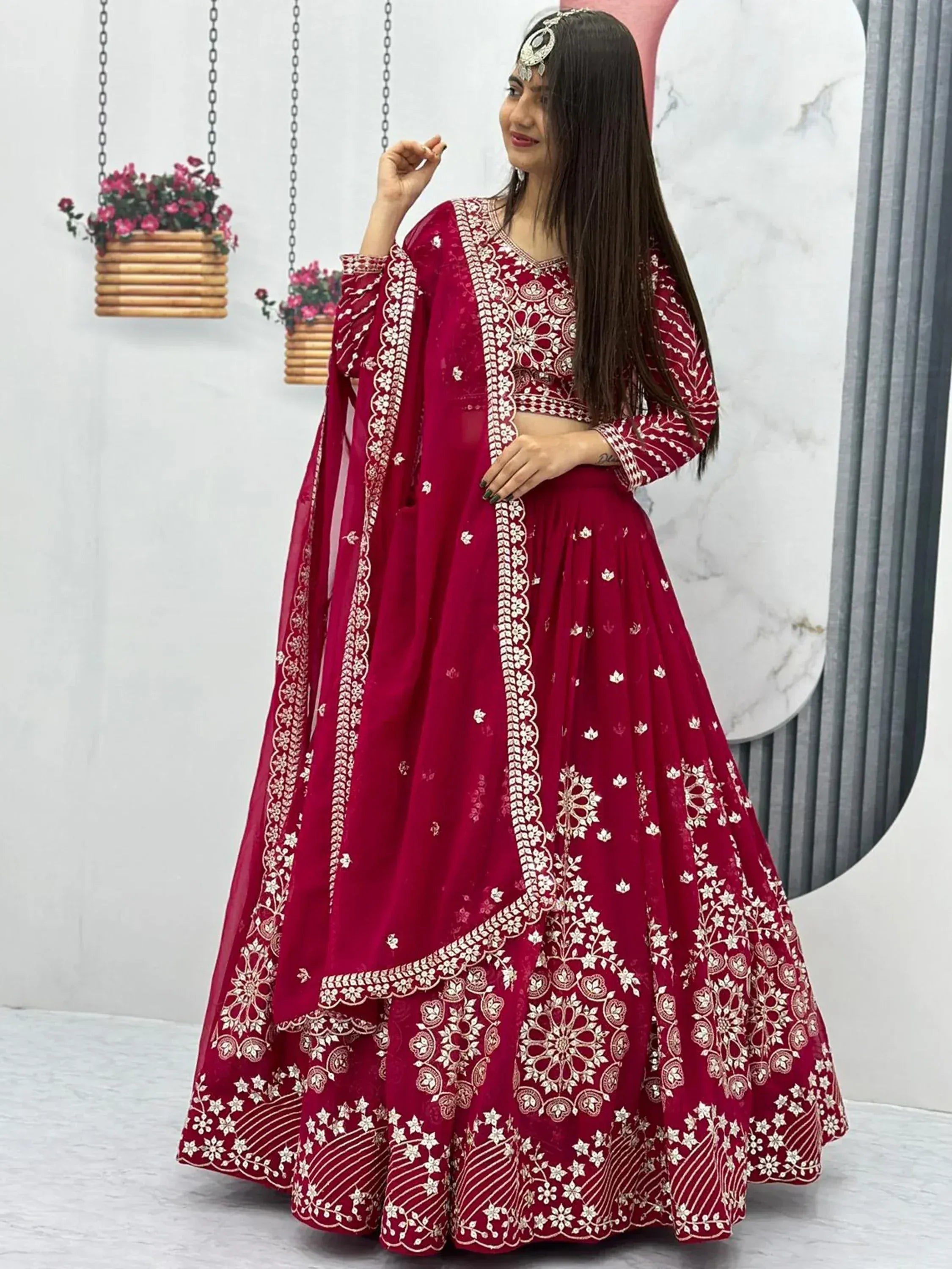 Red embroidered lehenga choli with floral patterns, perfect for Indian ethnic wear occasions