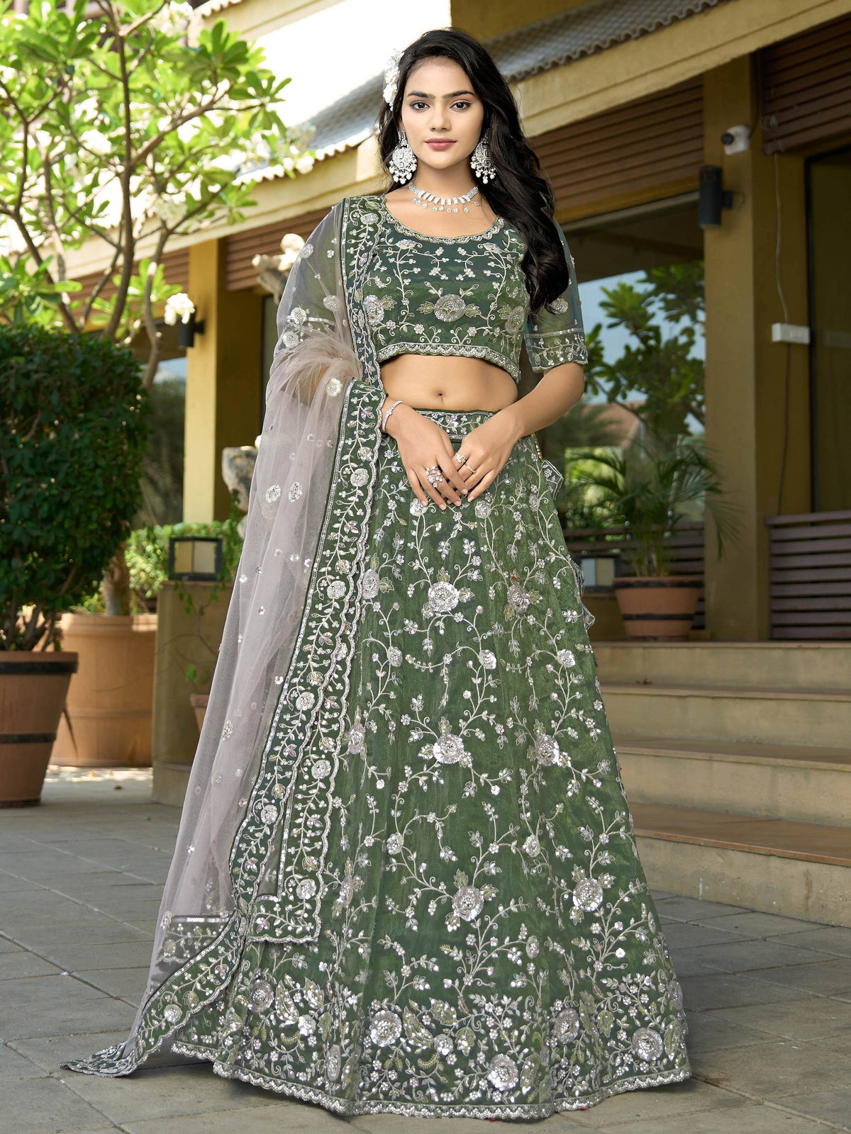 Green embroidered lehenga choli with floral zari work and sheer dupatta for Indian ethnic wear