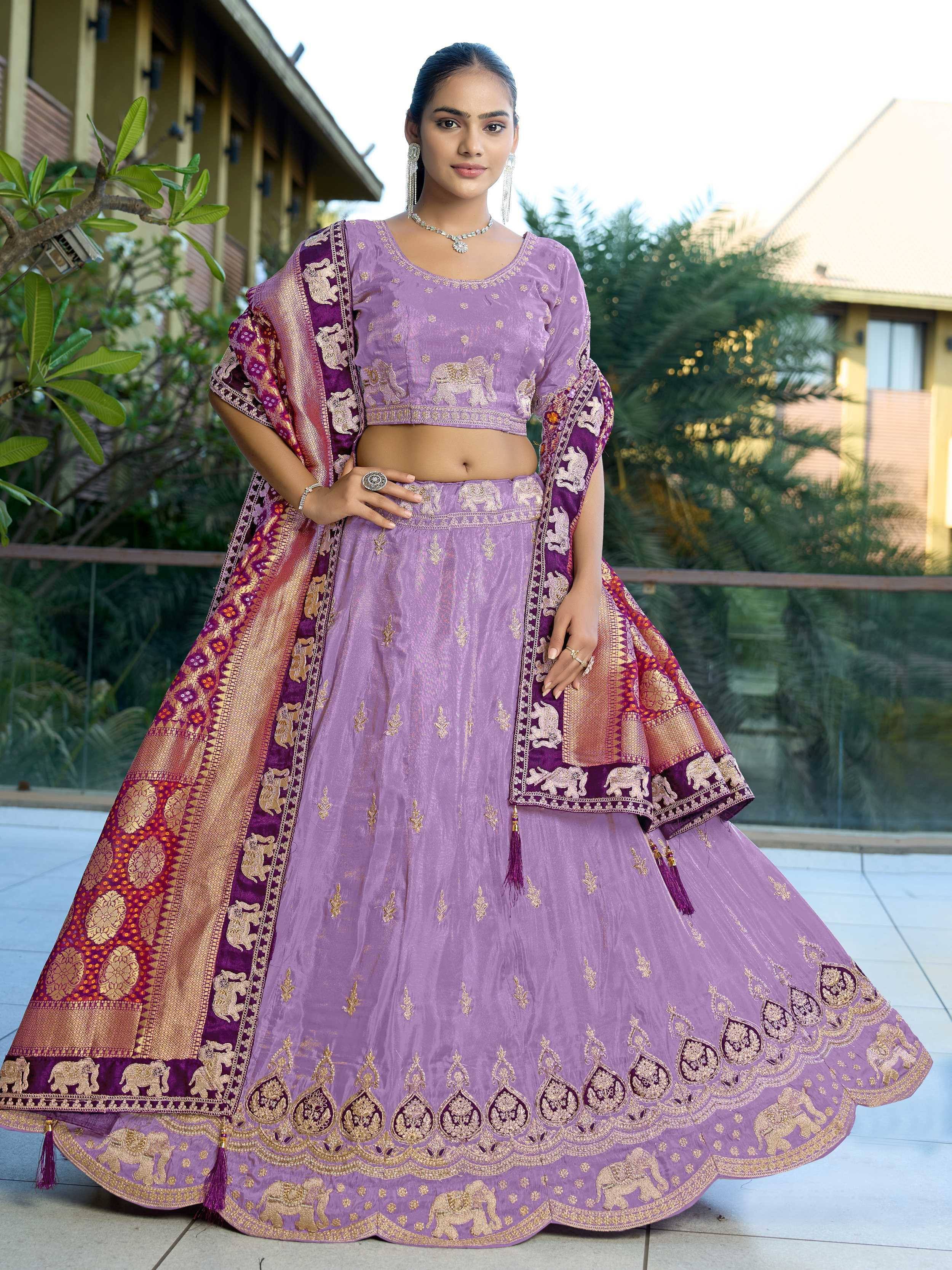Purple embroidered lehenga choli with elephant motifs and gold detailing, perfect for Indian ethnic wear.