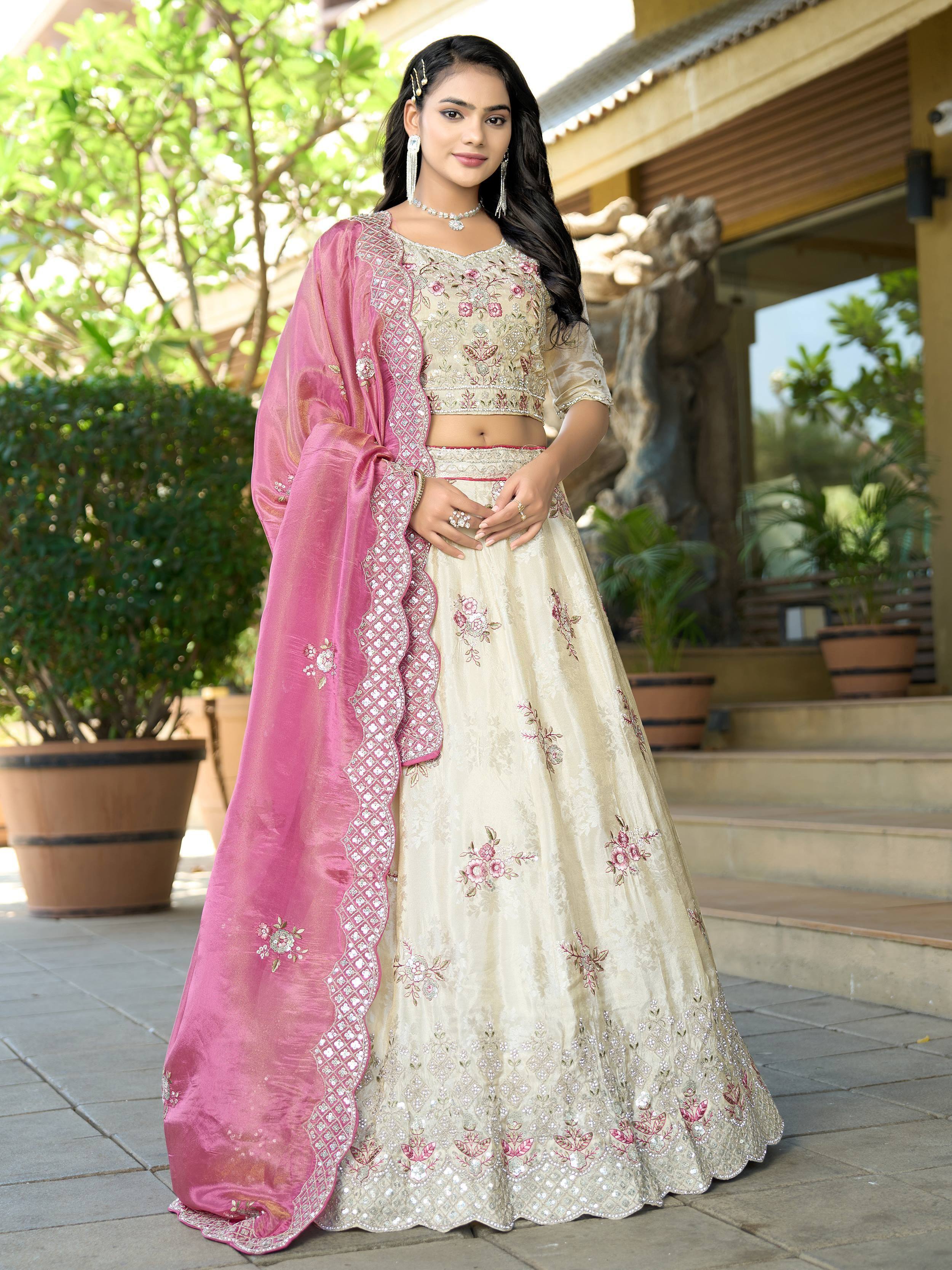 Cream floral embroidered lehenga choli with pink dupatta, perfect for Indian ethnic occasions