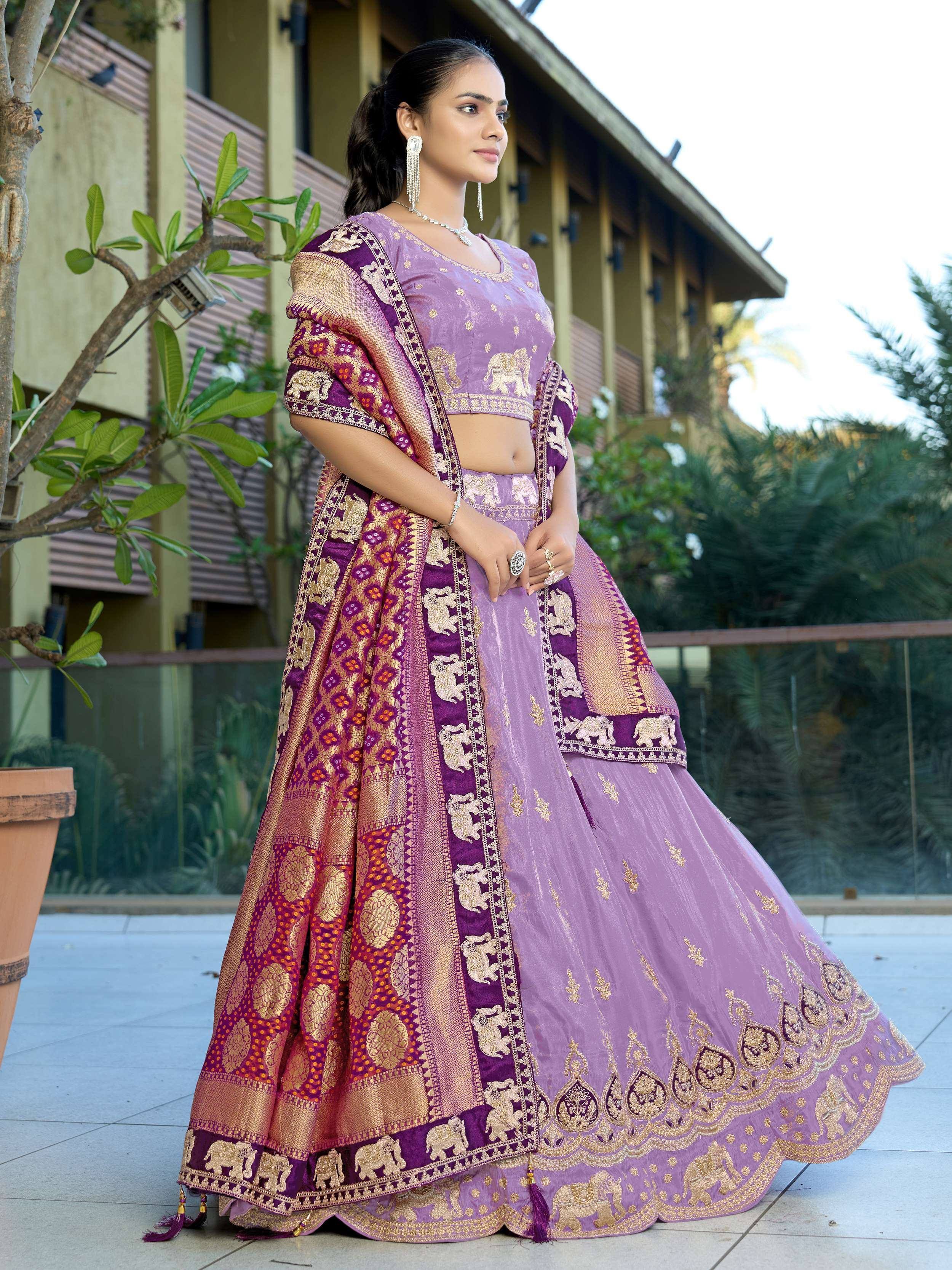 Purple designer lehenga choli with gold elephant embroidery and matching dupatta for Indian ethnic wear