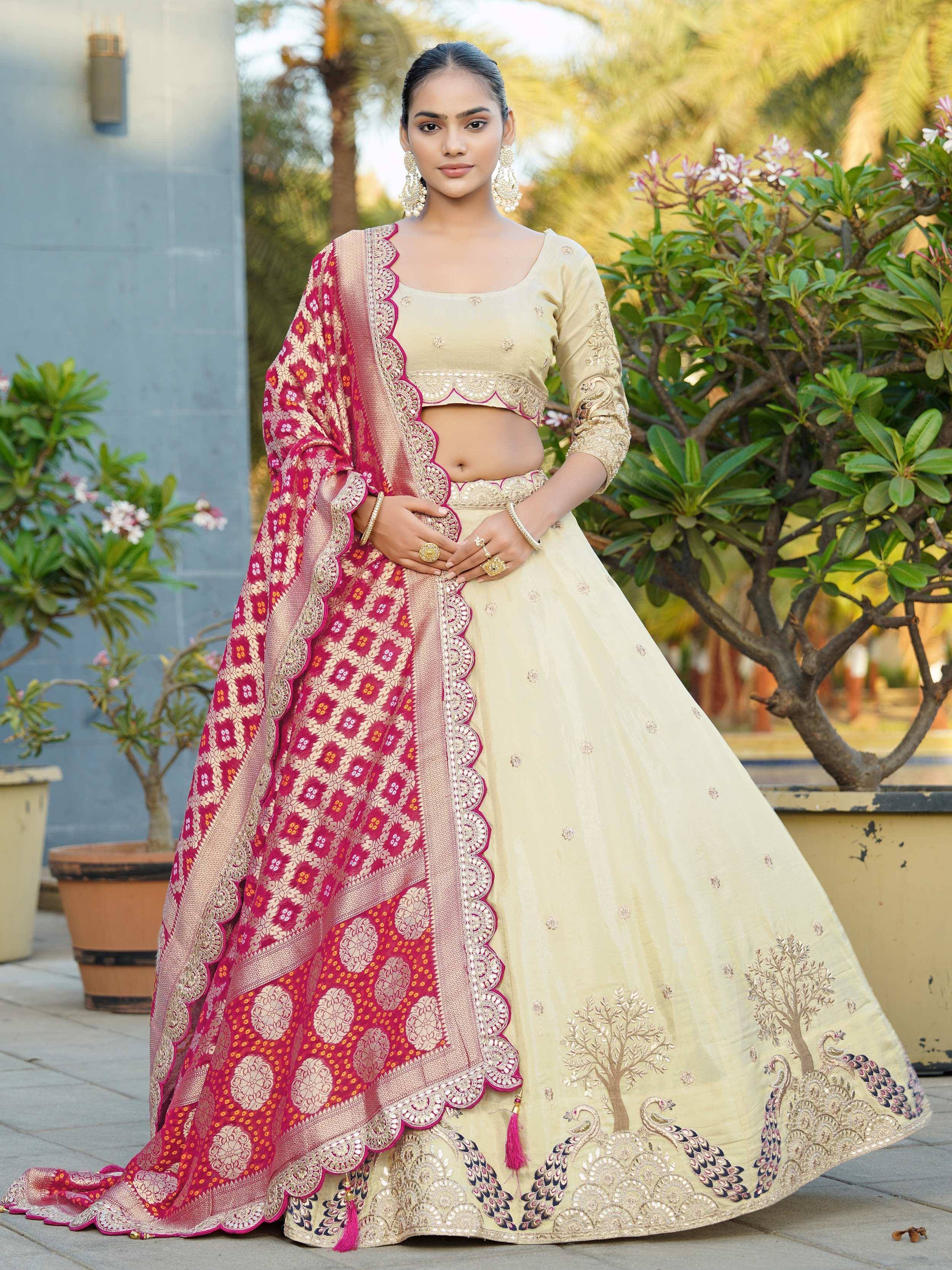 Elegant beige lehenga choli with peacock embroidery and pink floral dupatta, perfect for Indian ethnic wear occasions.