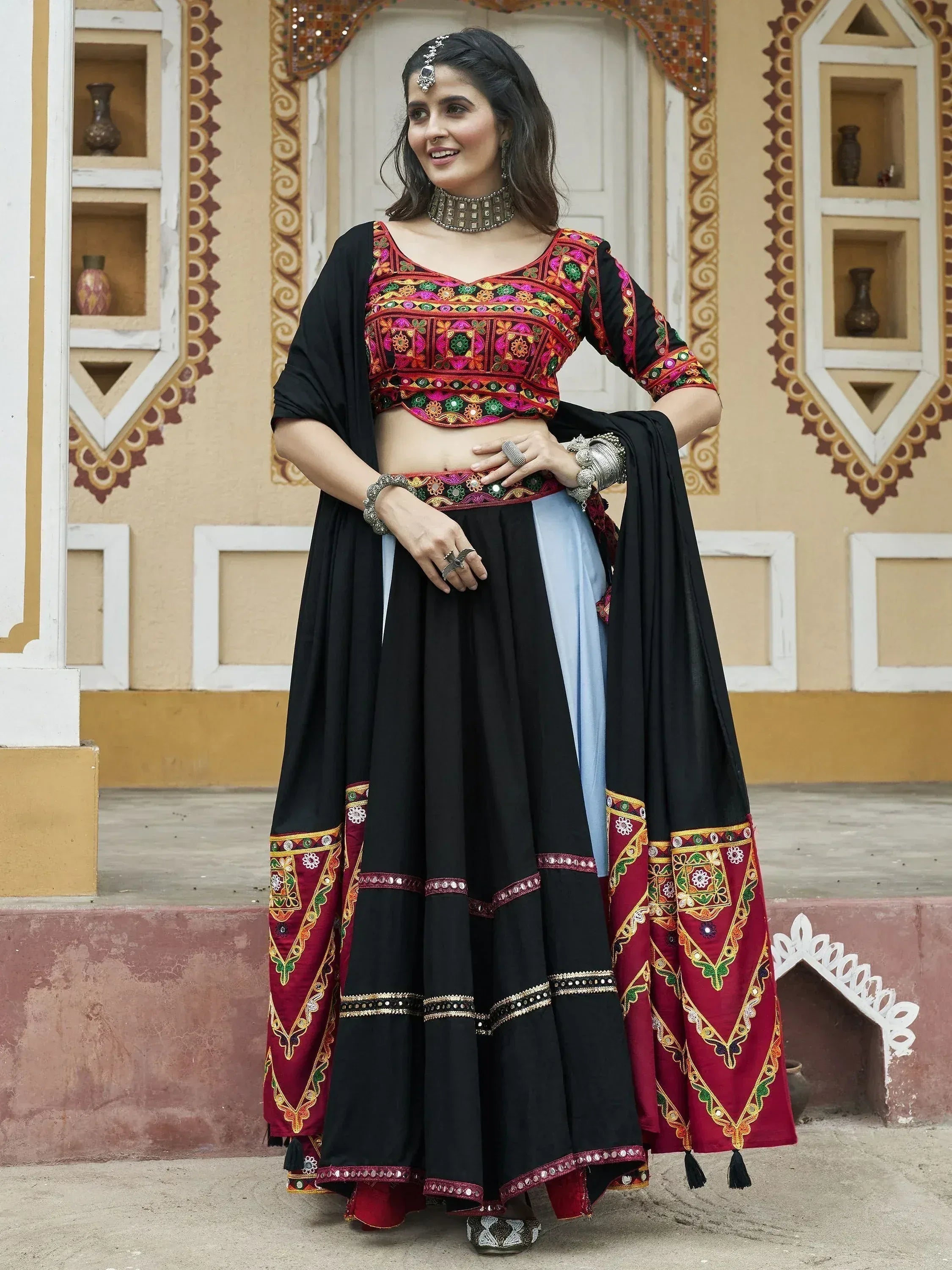 Black and maroon embroidered lehenga choli with mirror work, perfect for Indian ethnic wear occasions
