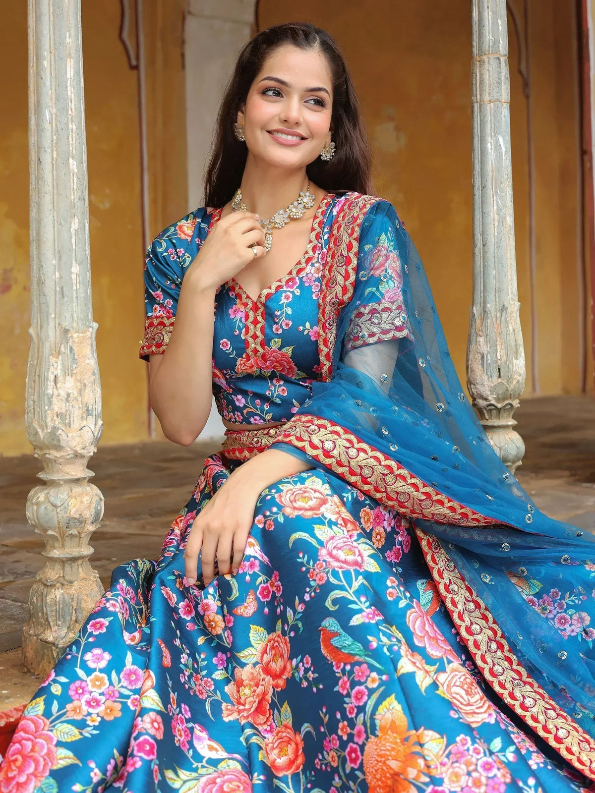 Blue floral lehenga choli with red gold border, ethnic Indian wear for weddings and festivals