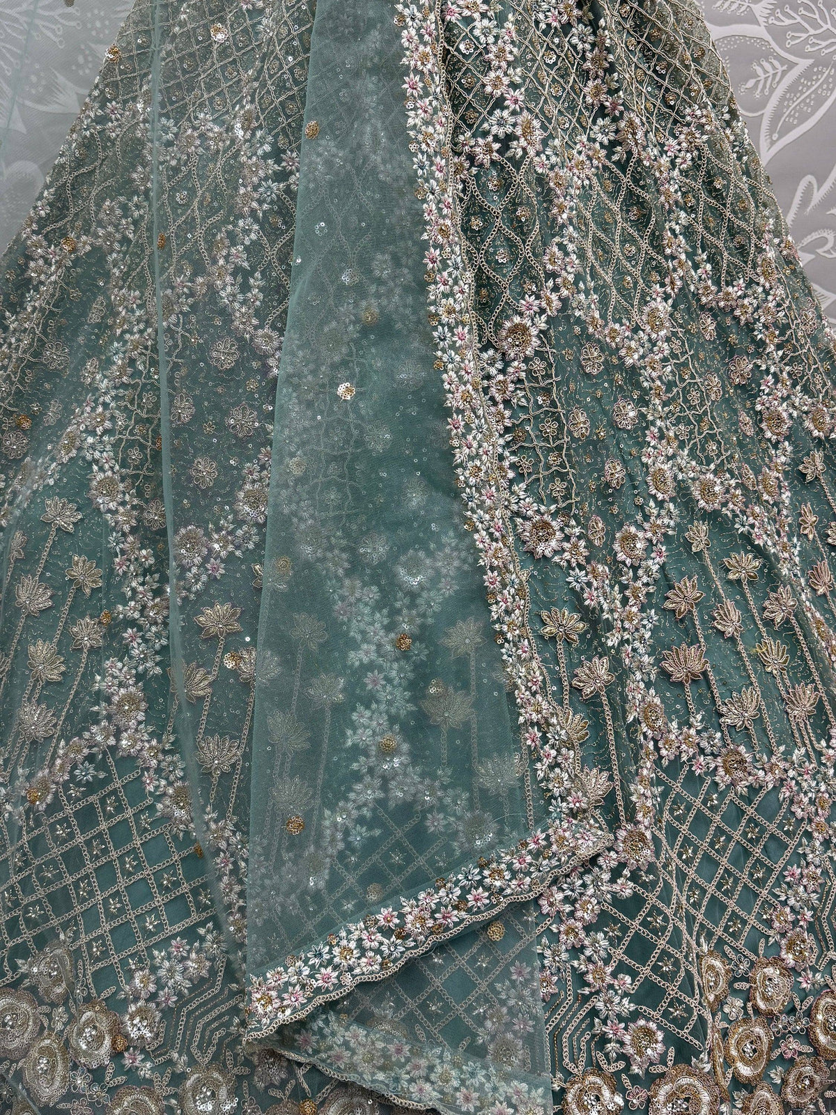 Teal designer lehenga with floral embroidery and sequin work, perfect for Indian ethnic wear
