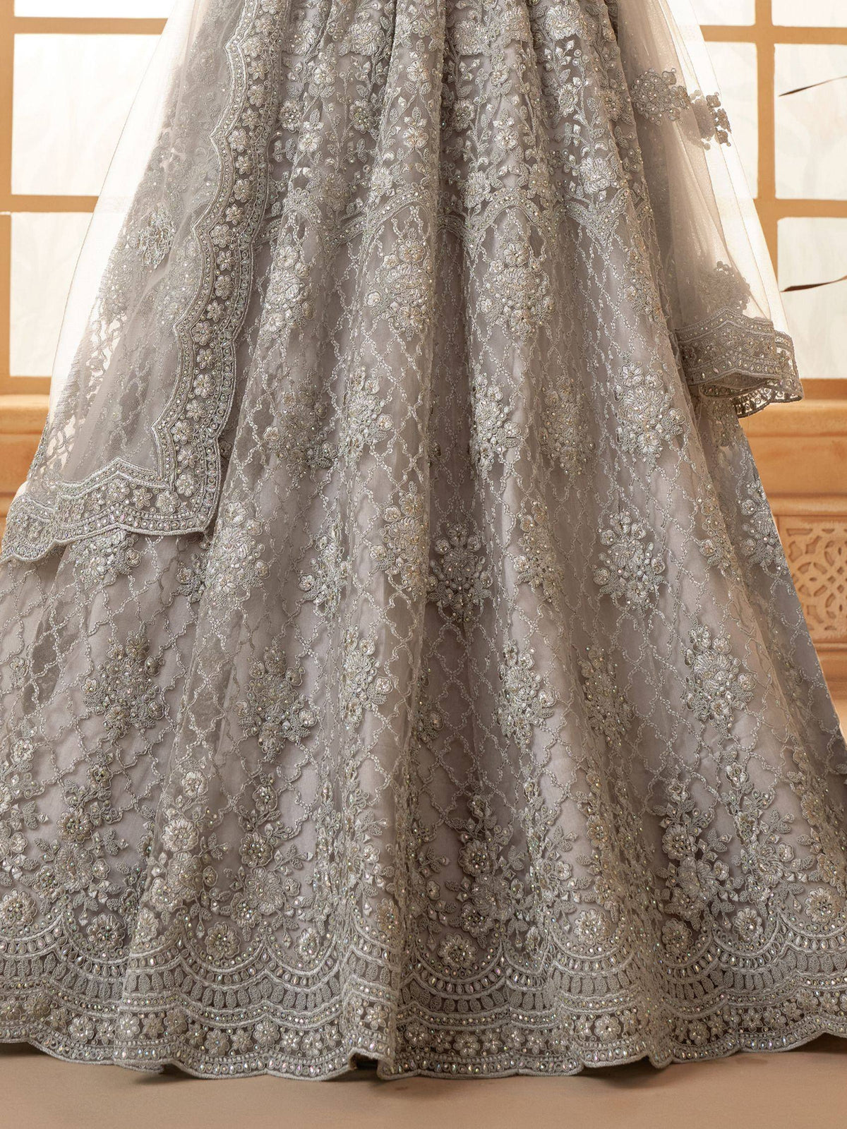 Elegant grey lehenga with intricate floral embroidery and beadwork, perfect for Indian ethnic wear.