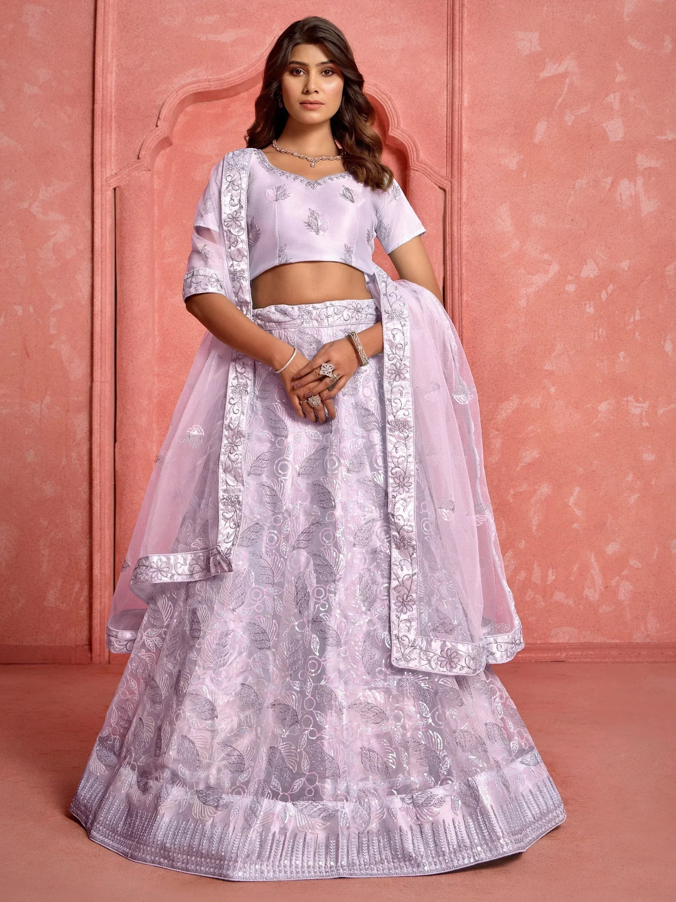 Lavender embroidered lehenga choli with floral motifs, perfect for Indian weddings and festive occasions.
