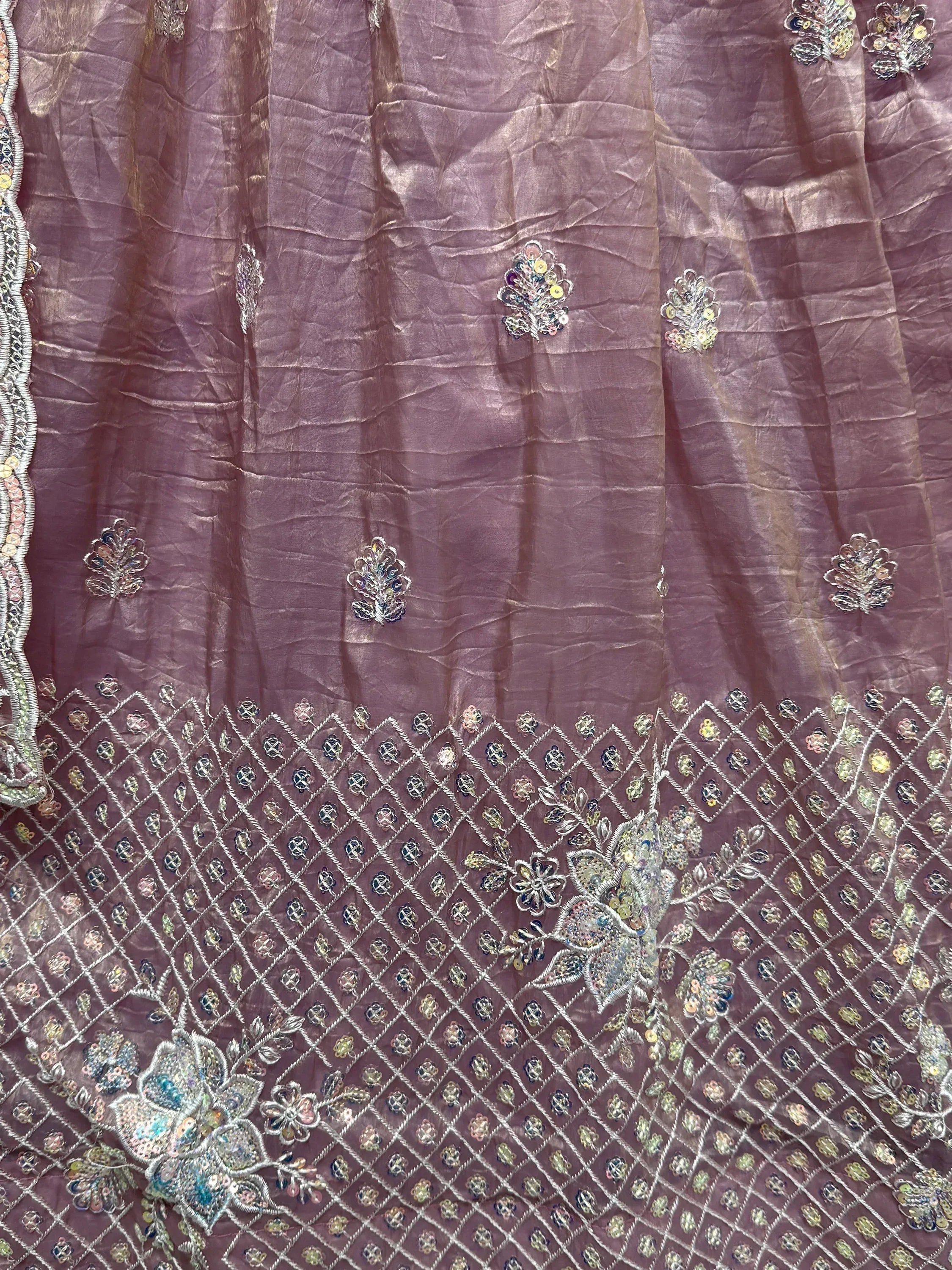 Mauve ethnic gown with intricate floral embroidery and sequin detailing, perfect for Indian occasions.